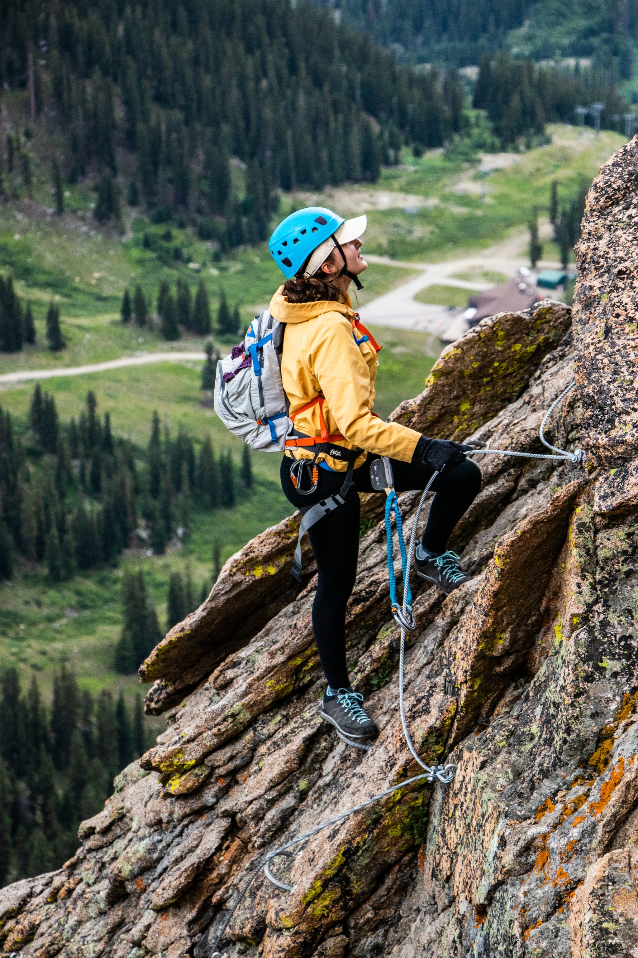 A climber stands on the rock at the highest Via Ferrata in North America at Arapahoe Basin Ski Area