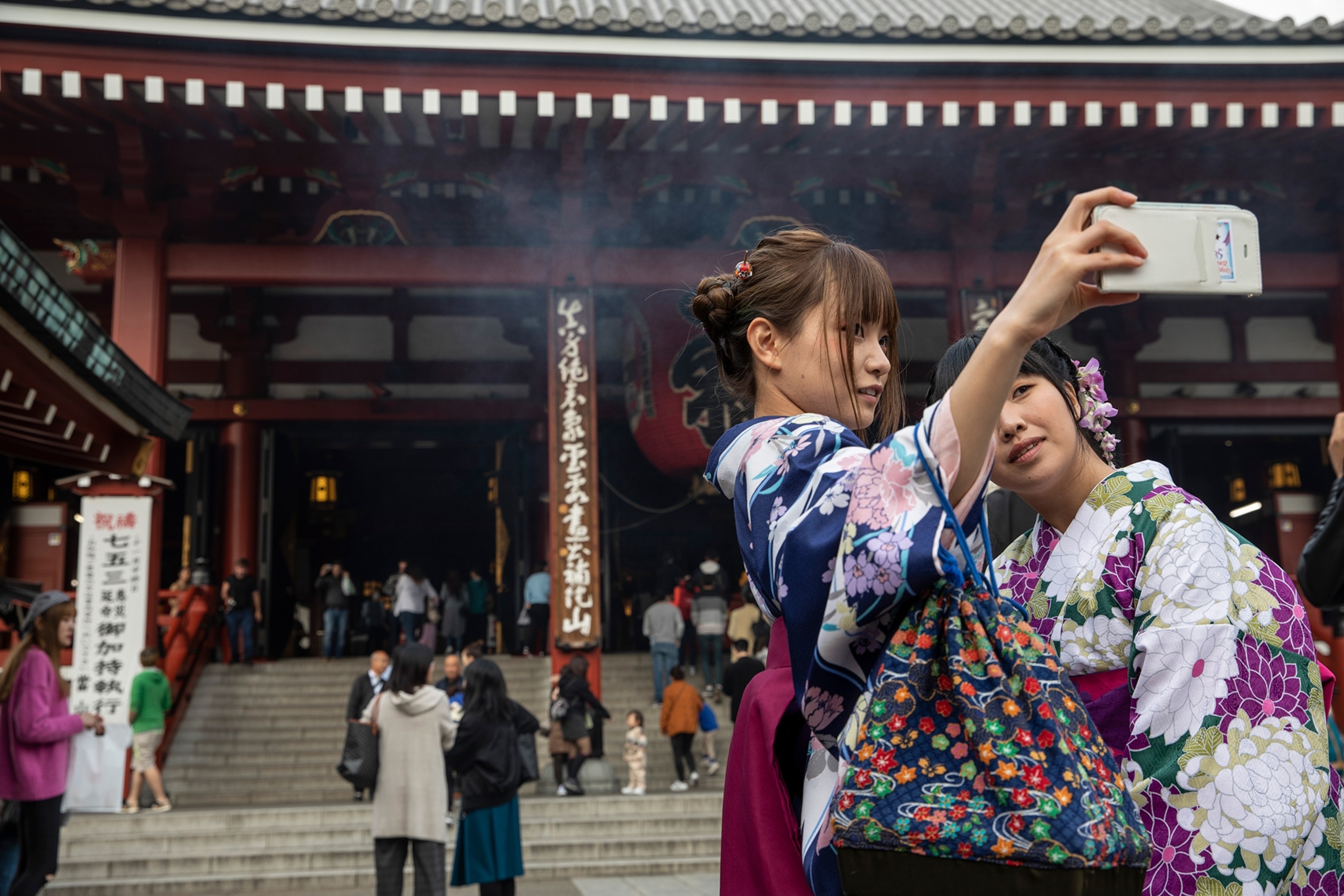 Girls dressed up in front of the temple.