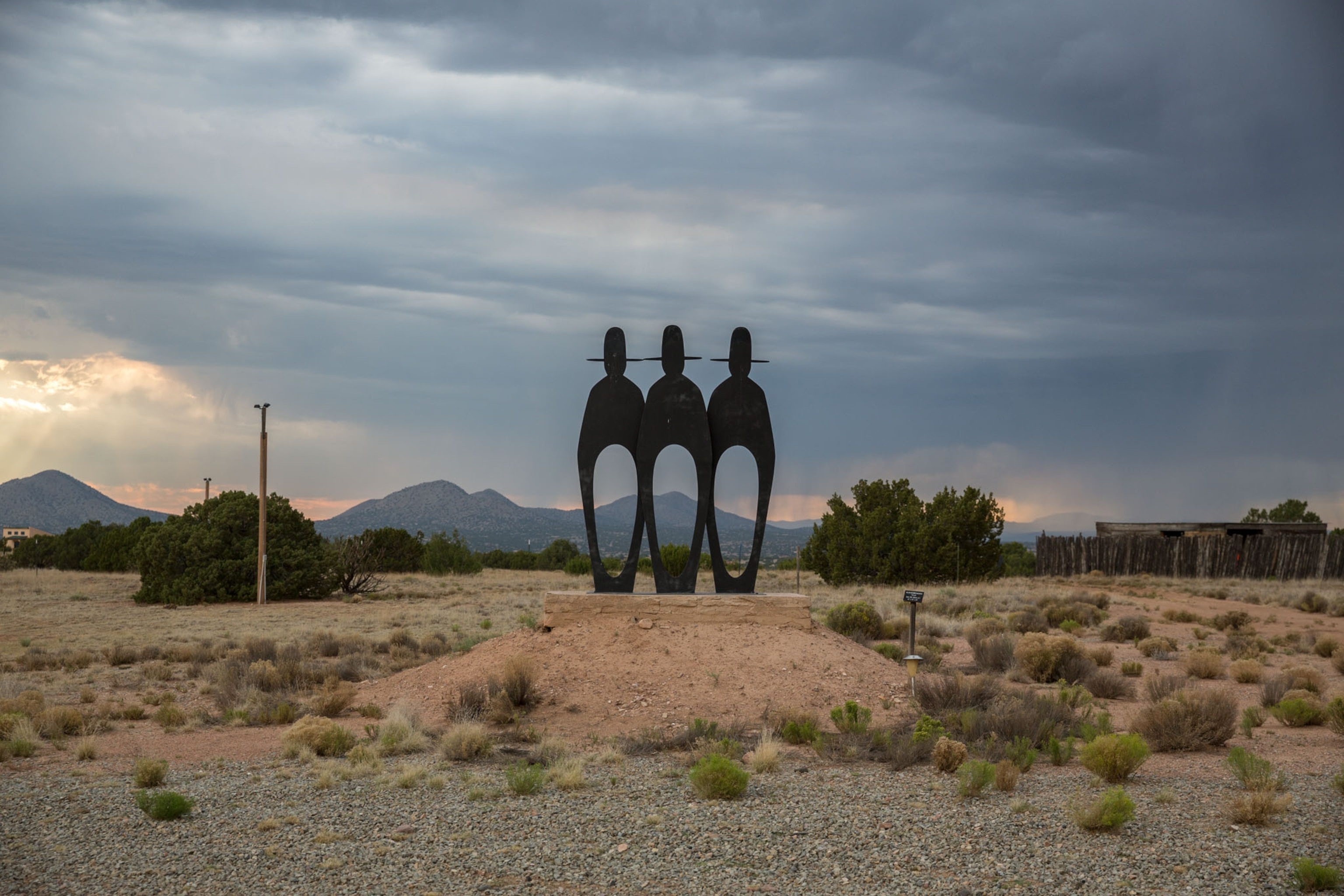 a modern statue during sunset in the dessert