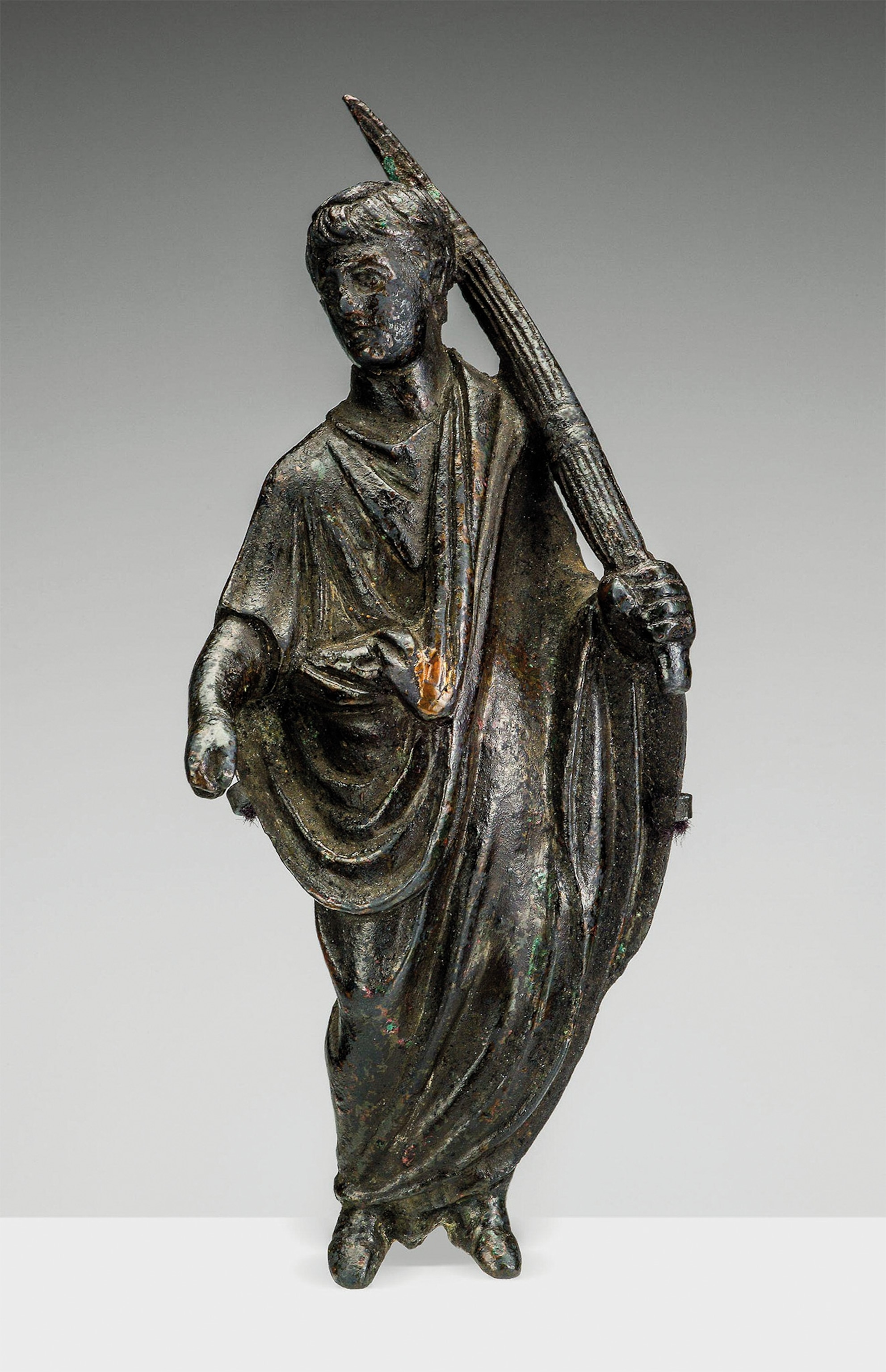 A first-century A.D. statuette depicts a lictor, an official bodyguard who would have attended Julius Caesar and other Roman officials.