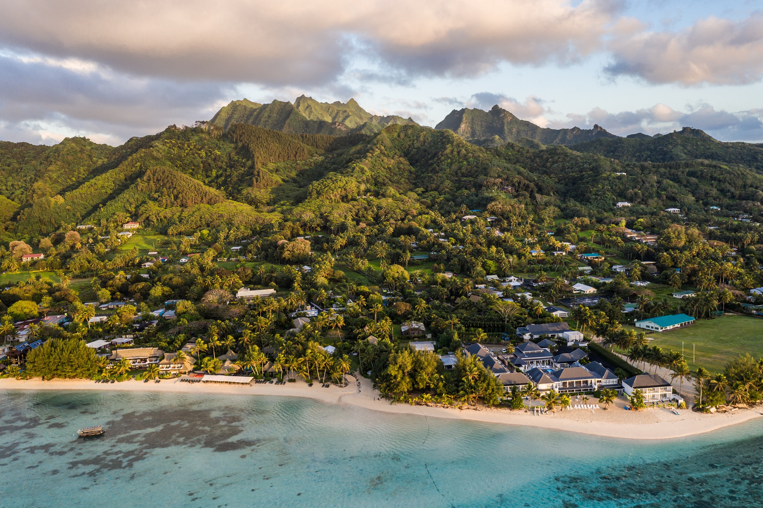 Sunrise over the famous Muri beach with dramatic mountain range in the Cook island in the south Pacific ocean