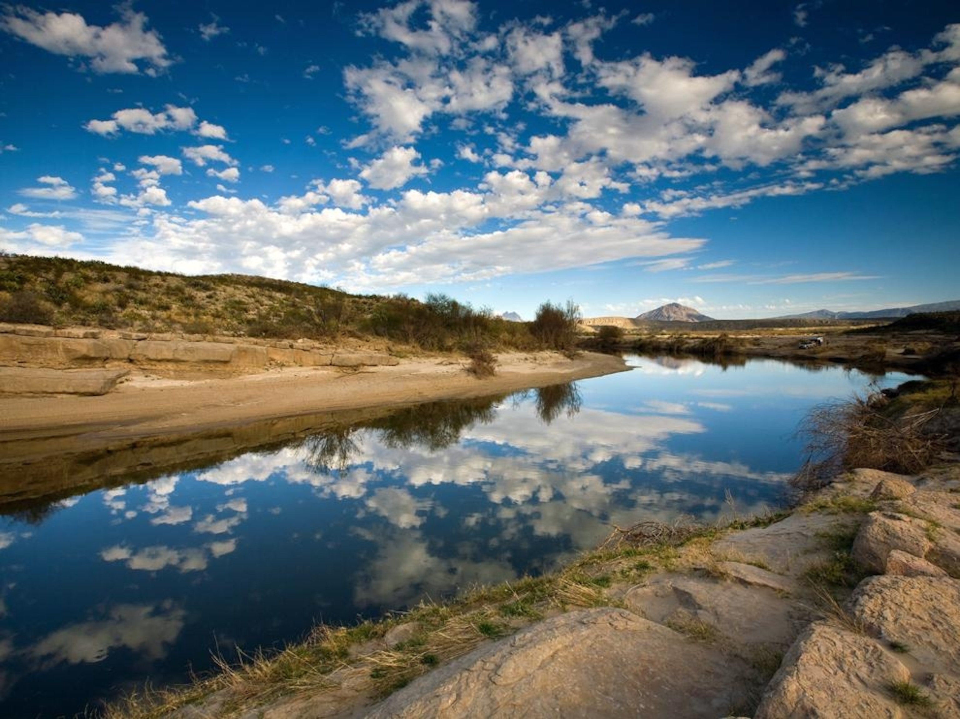 the Rio Grande River with blue sky and clouds