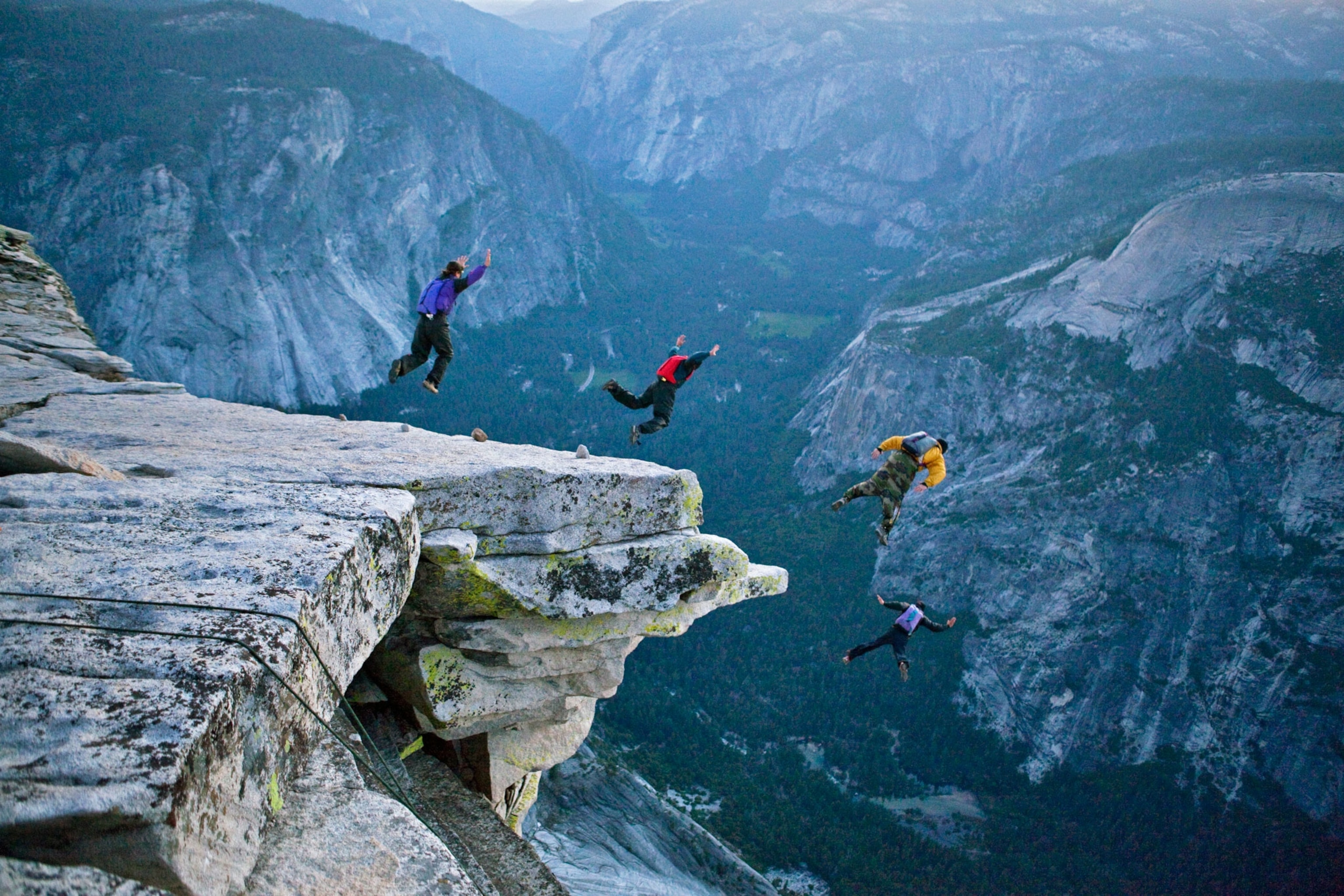 people BASE jumping off of Half Dome