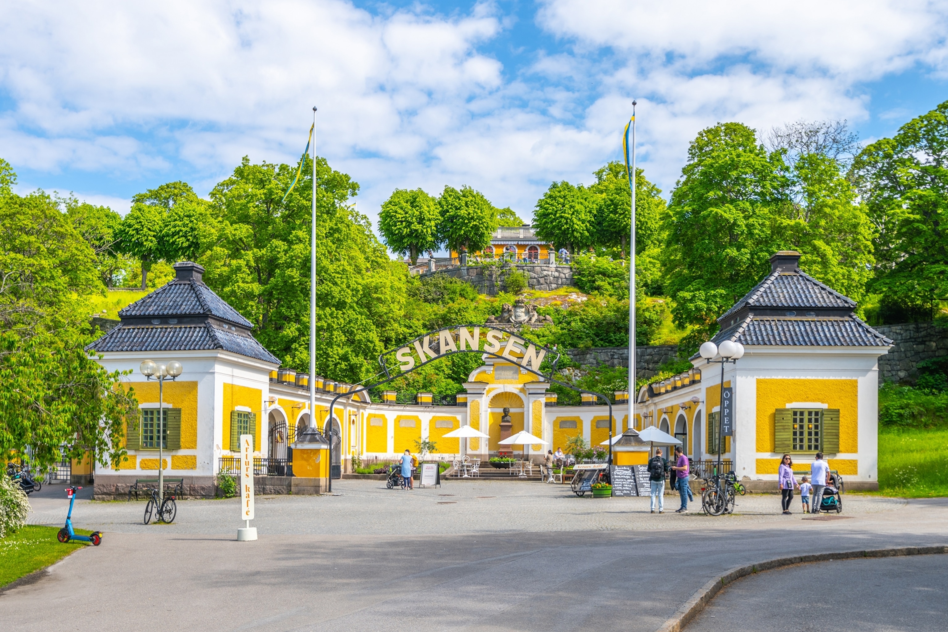 The front entrance of the yellow and white Skansen museum in Stockholm, Sweden