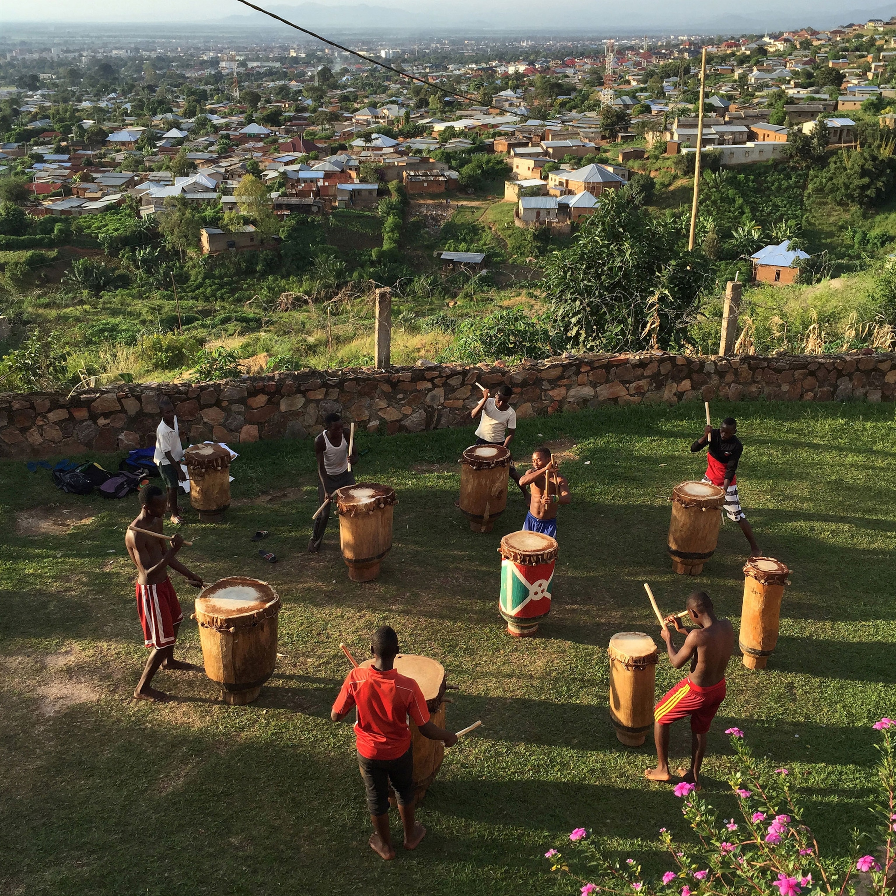 percussion ensemble practicing on a hillside overlooking Bujumbura, Burundi