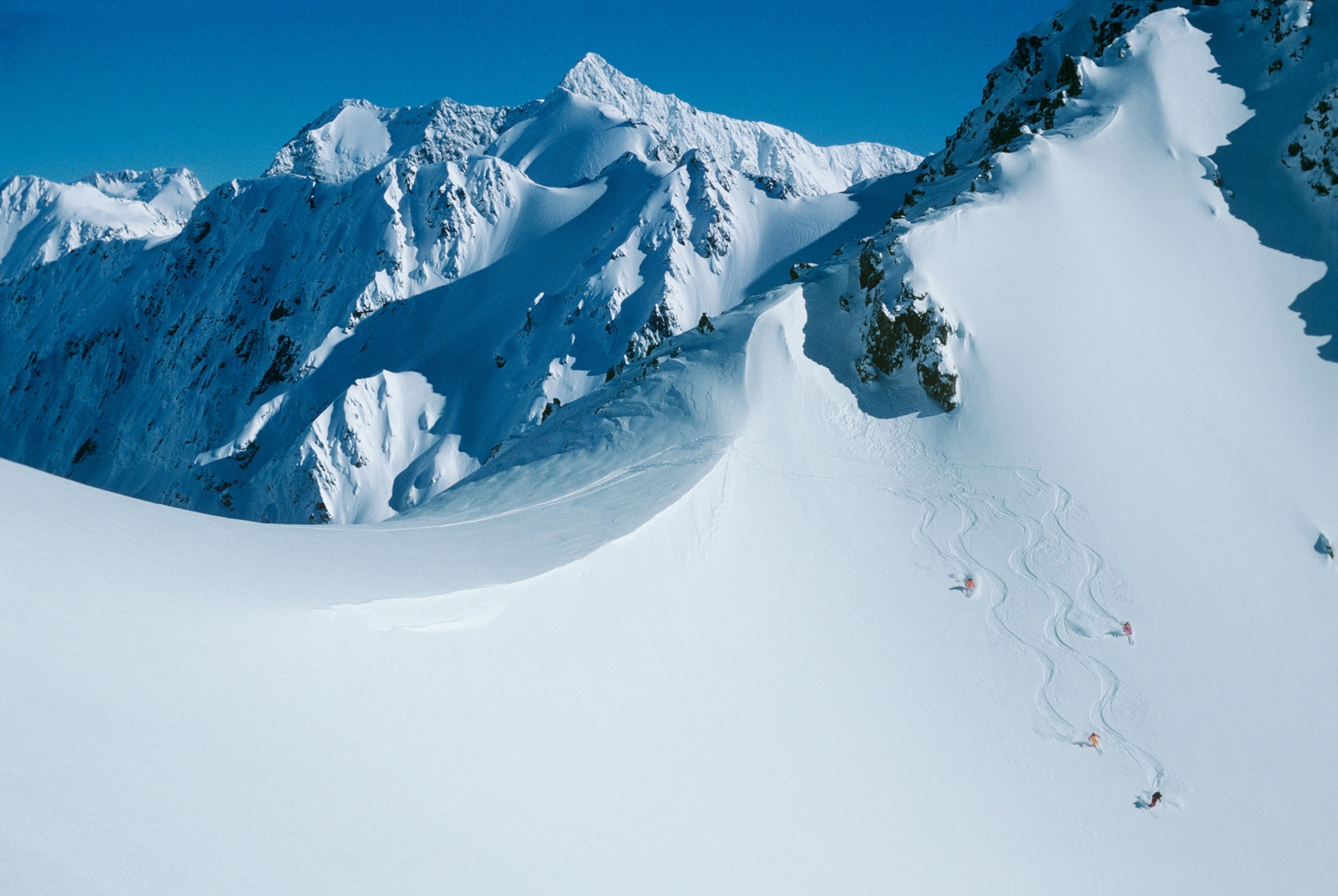 heli-skiers in the Southern Alps on the South Island of New Zealand