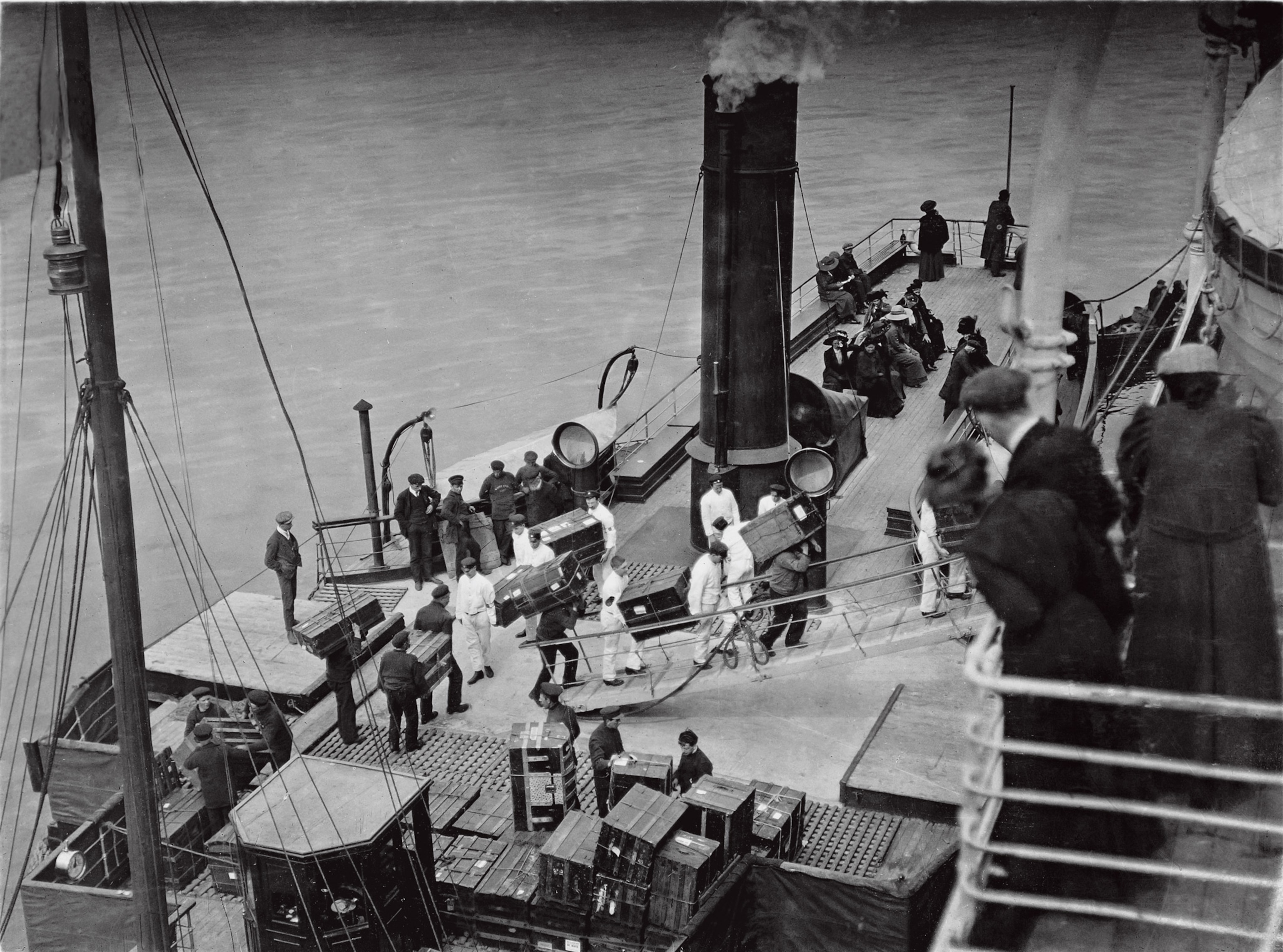 Photo of men carrying luggage up ramp