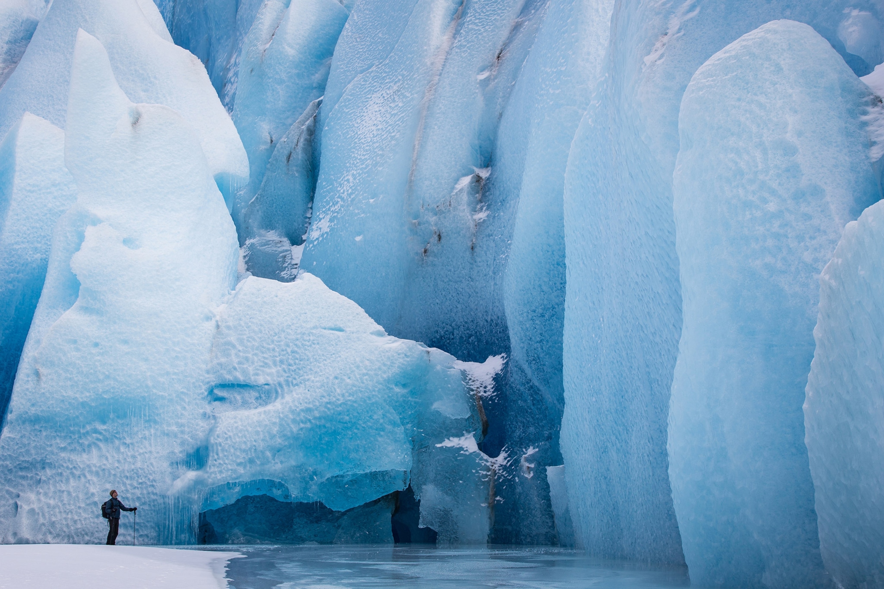a man exploring Knik Glacier in Alaska