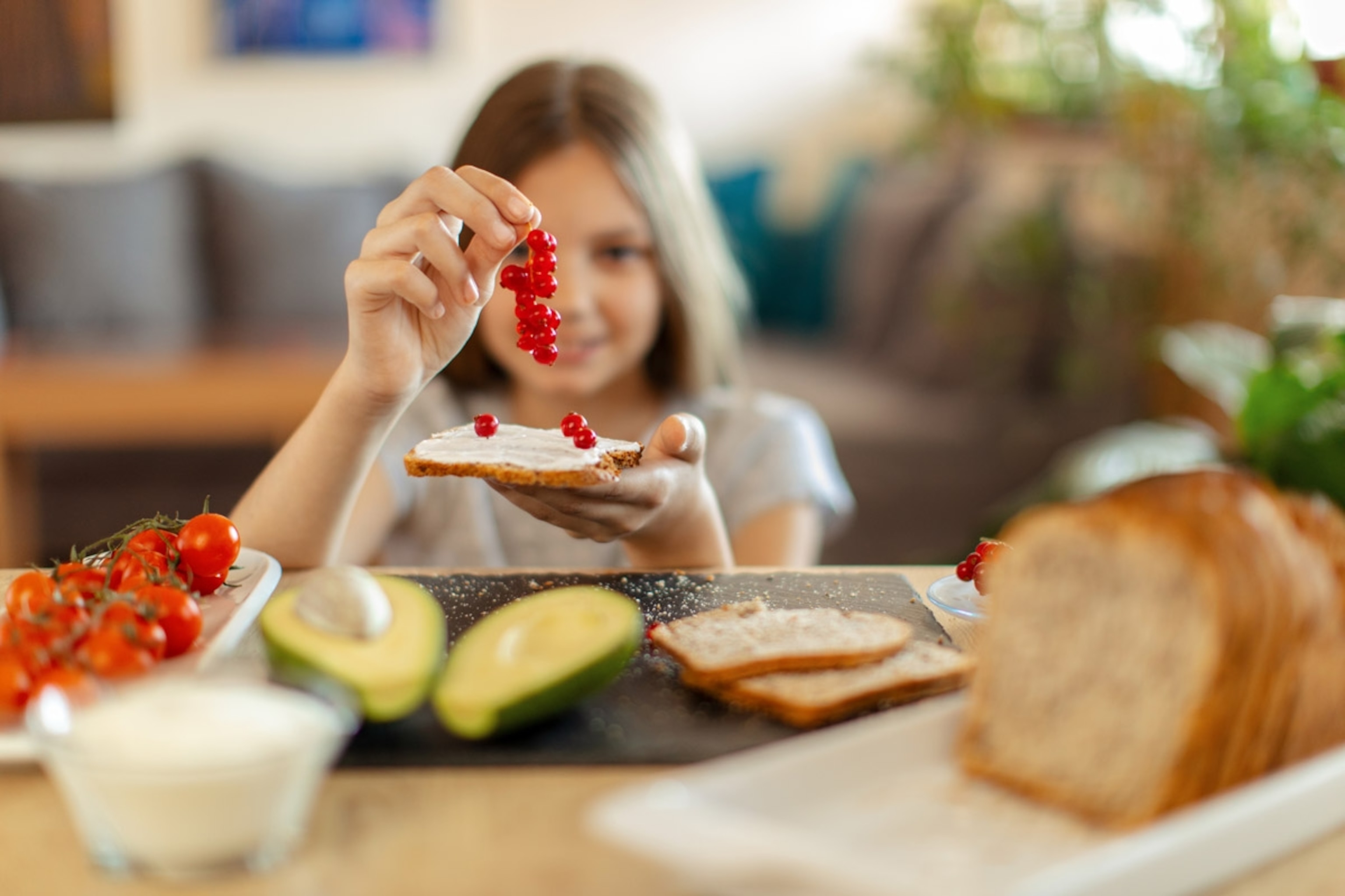 To some kids, the squishiness of red currants and the mushiness (not to mention the green-ness) of avocados make these foods "weird." But you can still get children to try them.