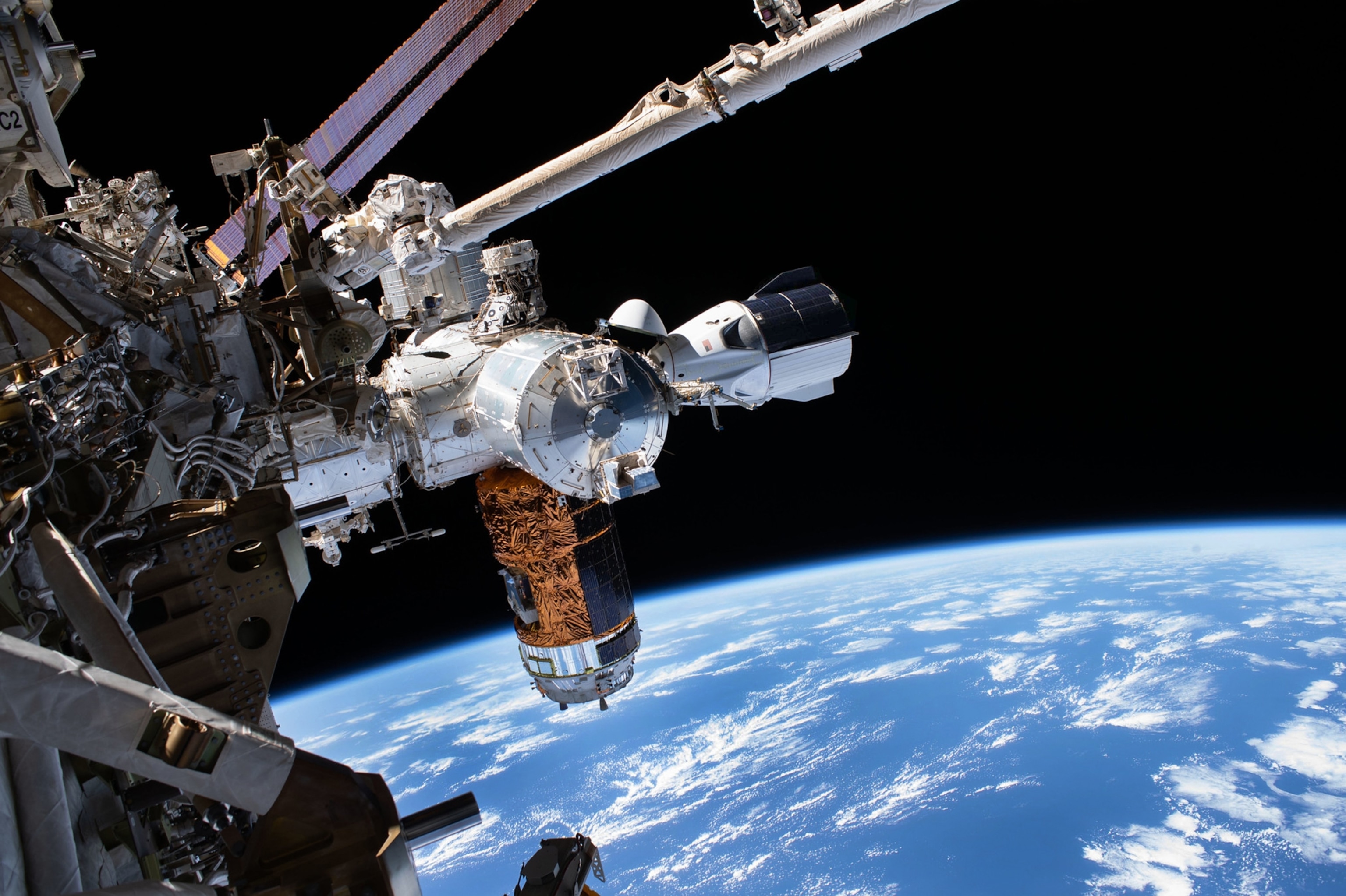 spacecraft over blue Earth.