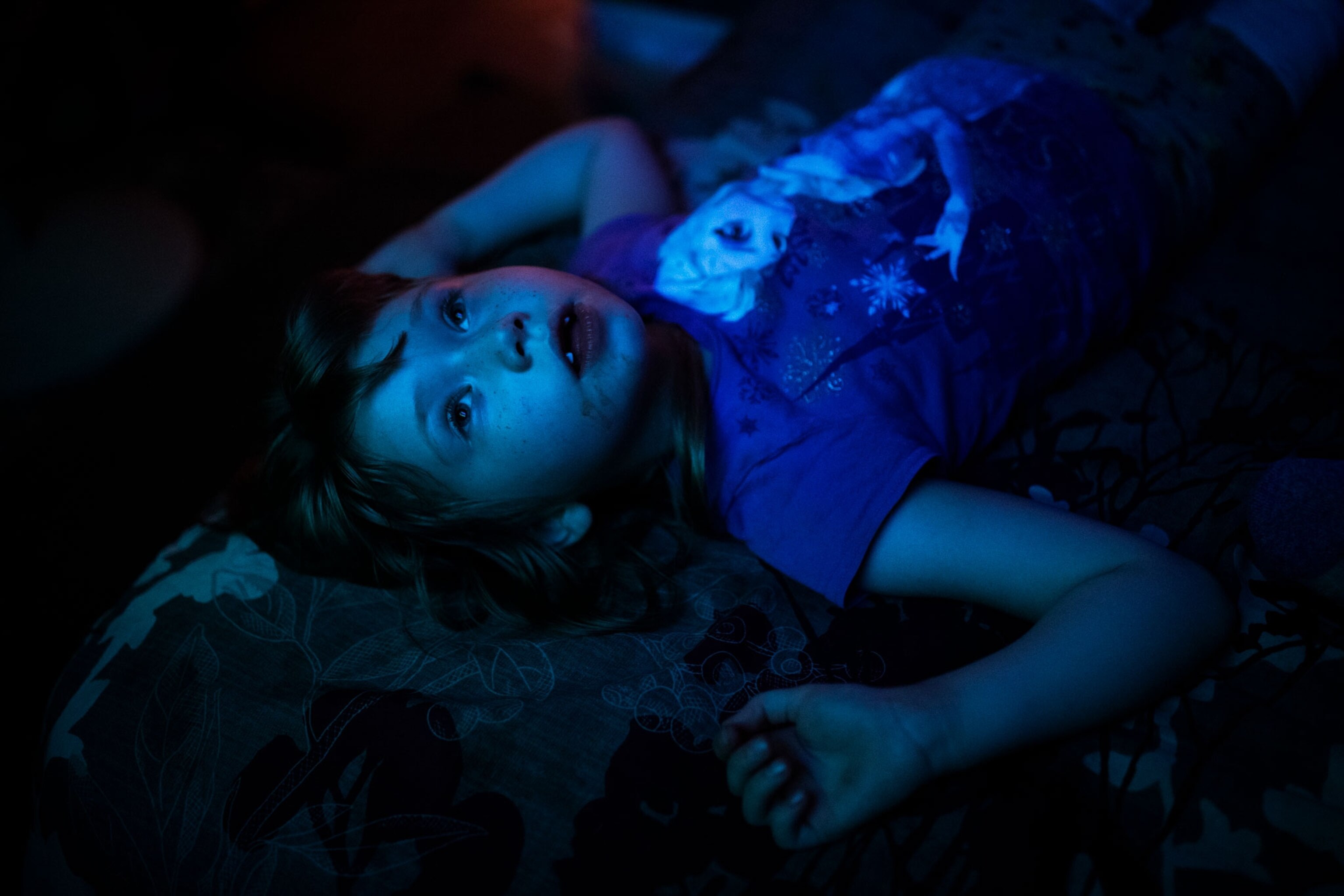 a girl lies on her bed at home in West Virginia