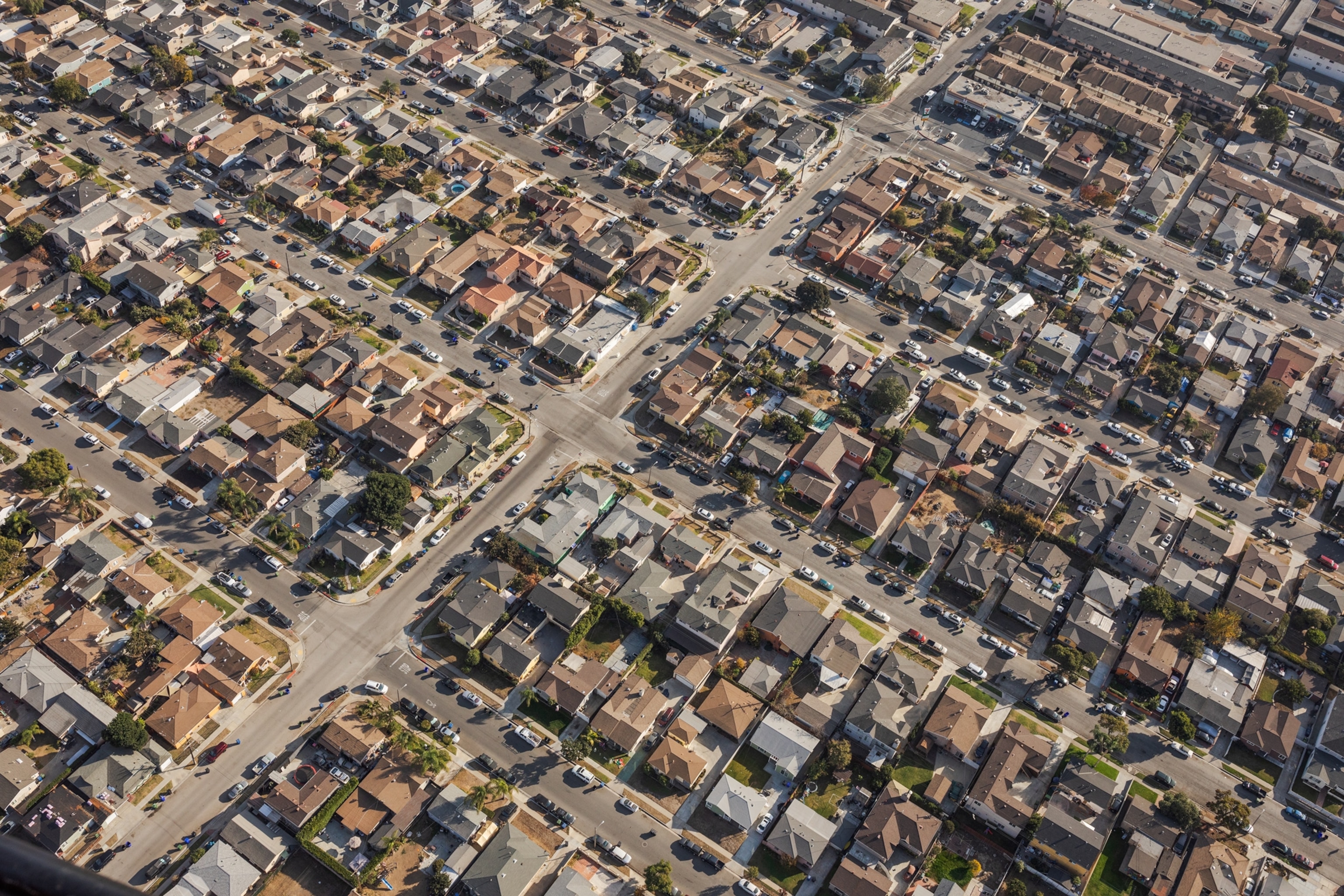 Picture of aerial view of neighborhood with little greens.