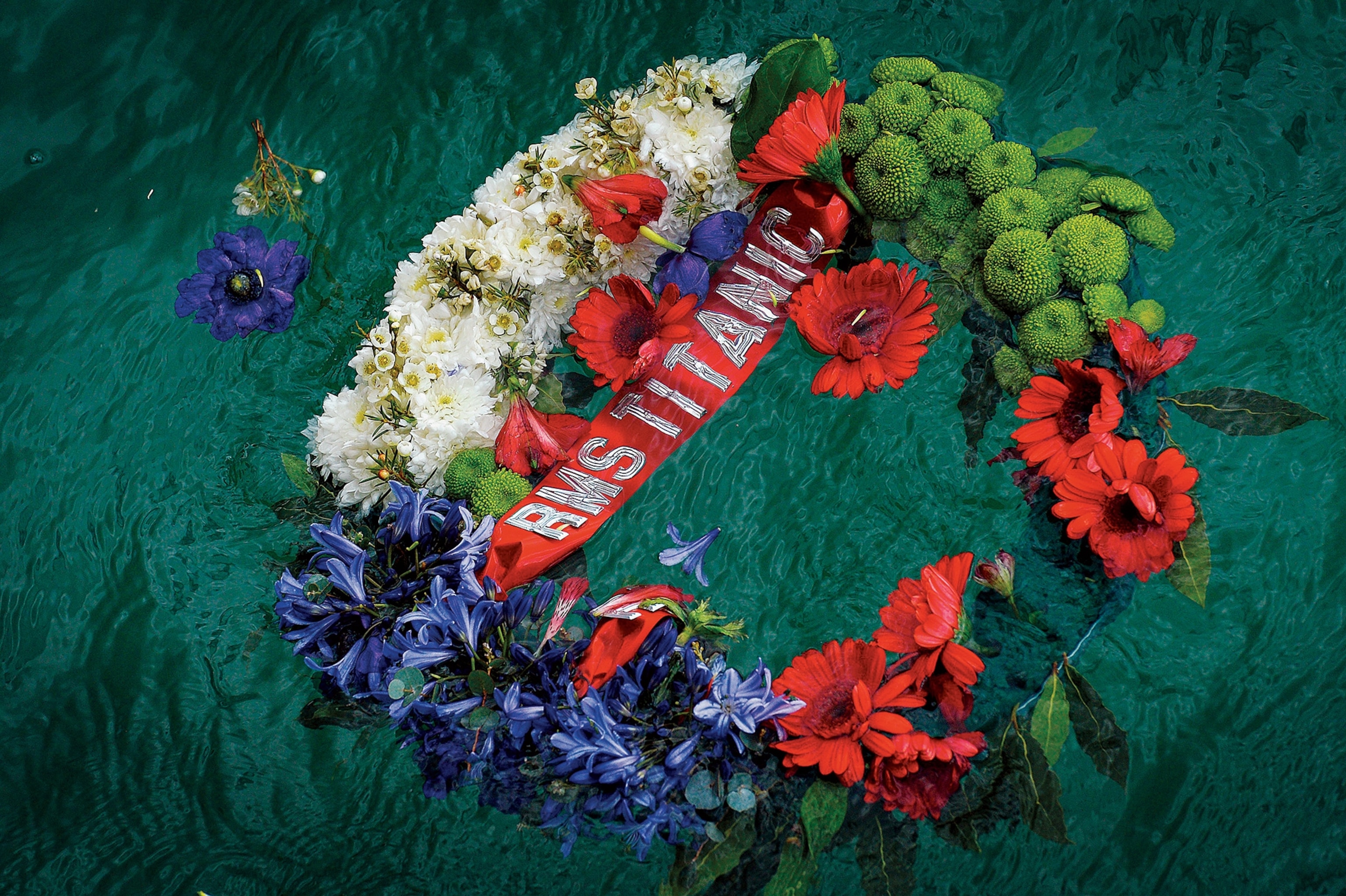 To commemorate those lost, a wreath floats in Southampton, England, in the same spot where the Titanic set sail on its illfated maiden voyage, April 10, 1912. “R.M.S.” stands for “Royal Mail Ship,” a designation given to the Titanic because it carried mail for the crown.