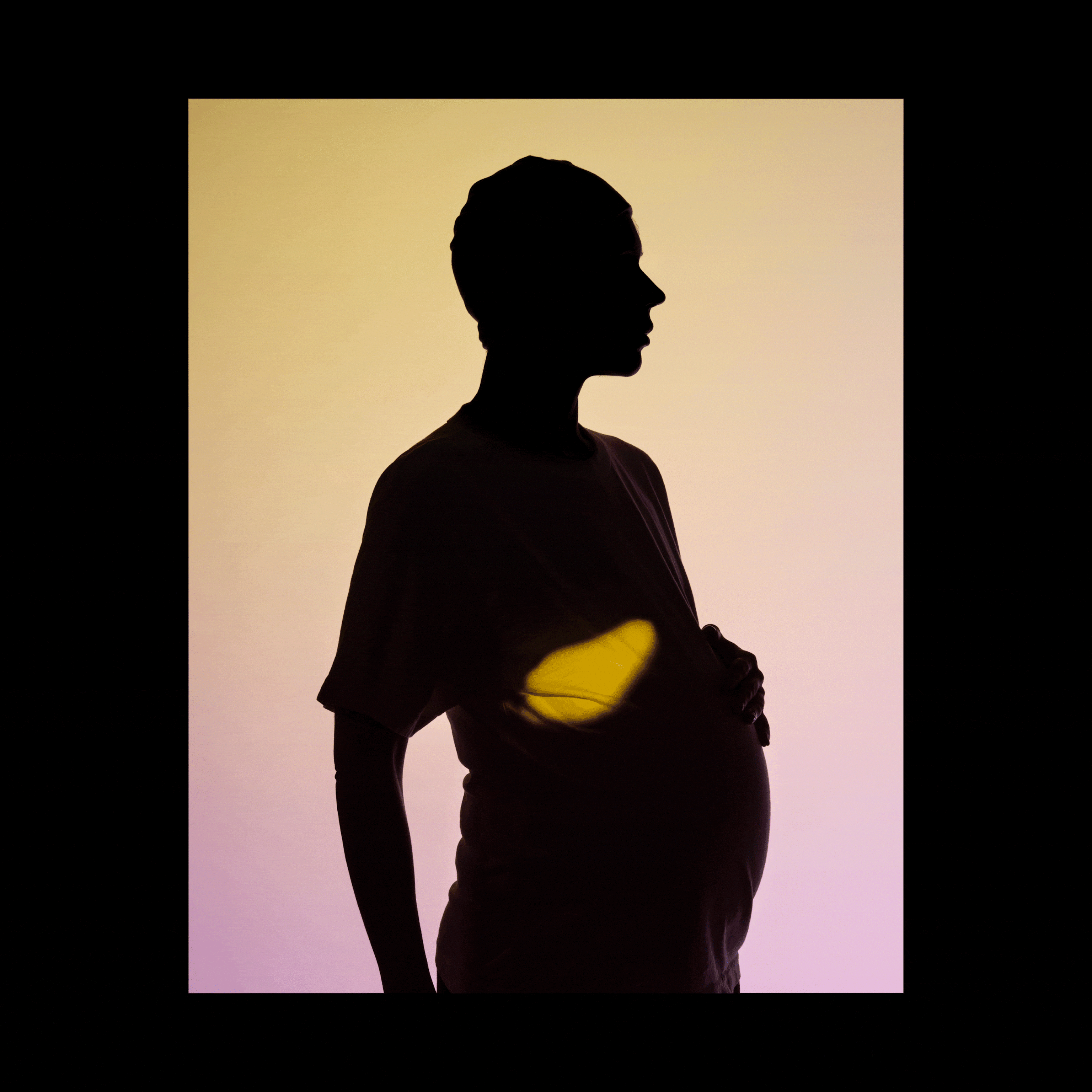 A woman silhouetted against a background that fade from yellow to pink; projections of a brain, pancreas, and fetus cycle every second, appearing on the silhouetted woman's body