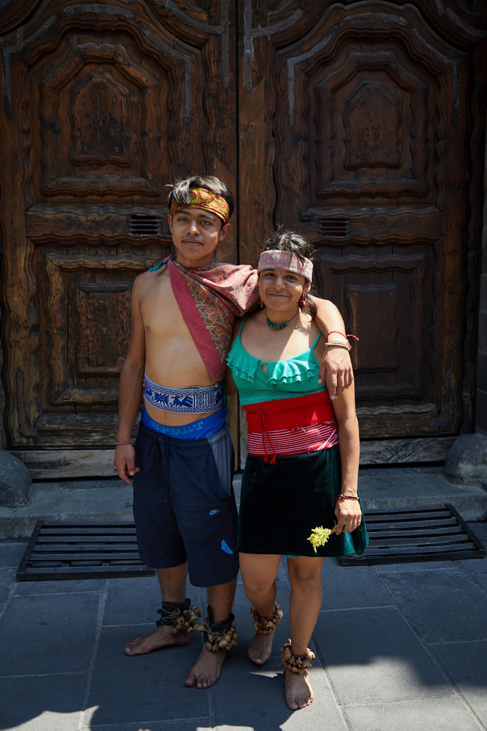 a boy and a woman stand beside each other in Mexico City