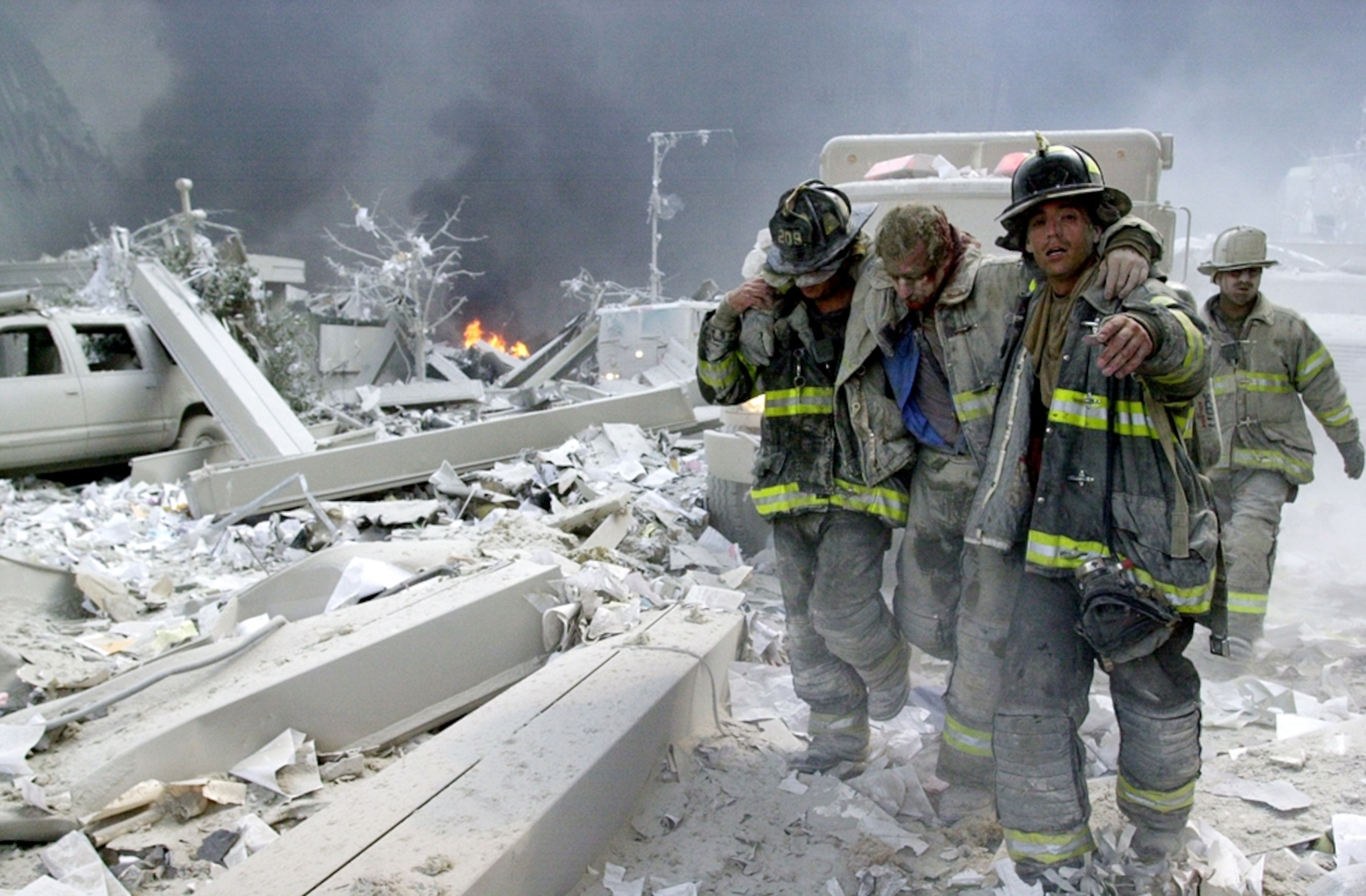 9/11 picture: firefighters helping an injured colleague