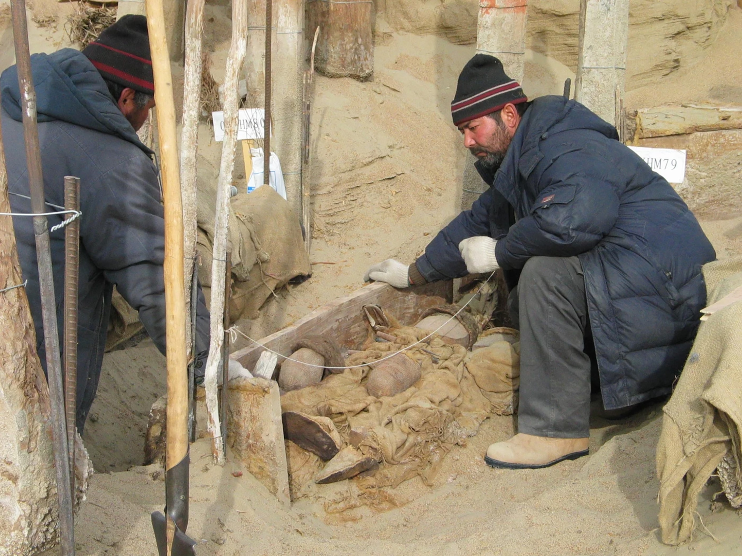 a man excavates a cemetery