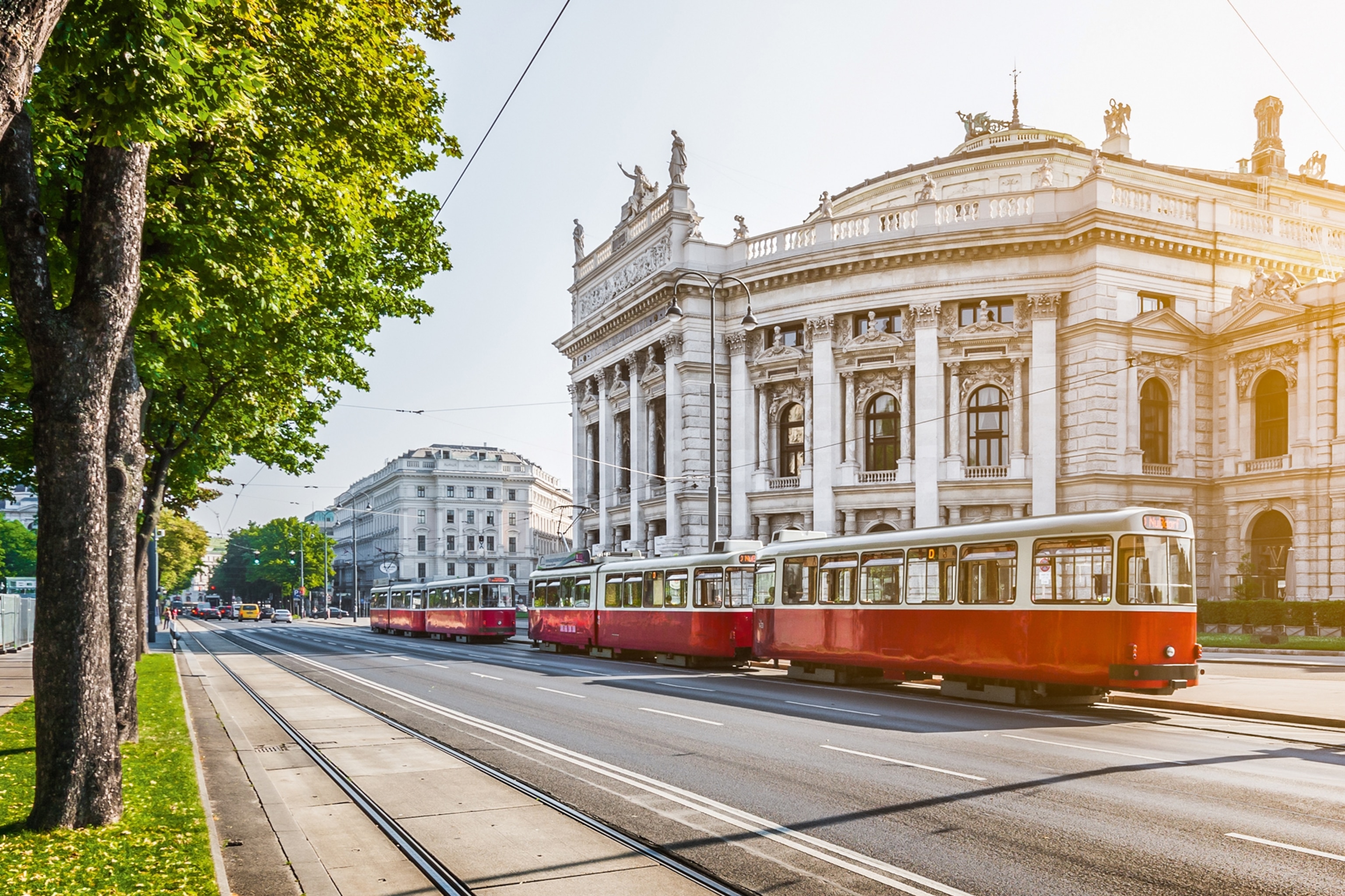 Tram in front of a building in Vienna.