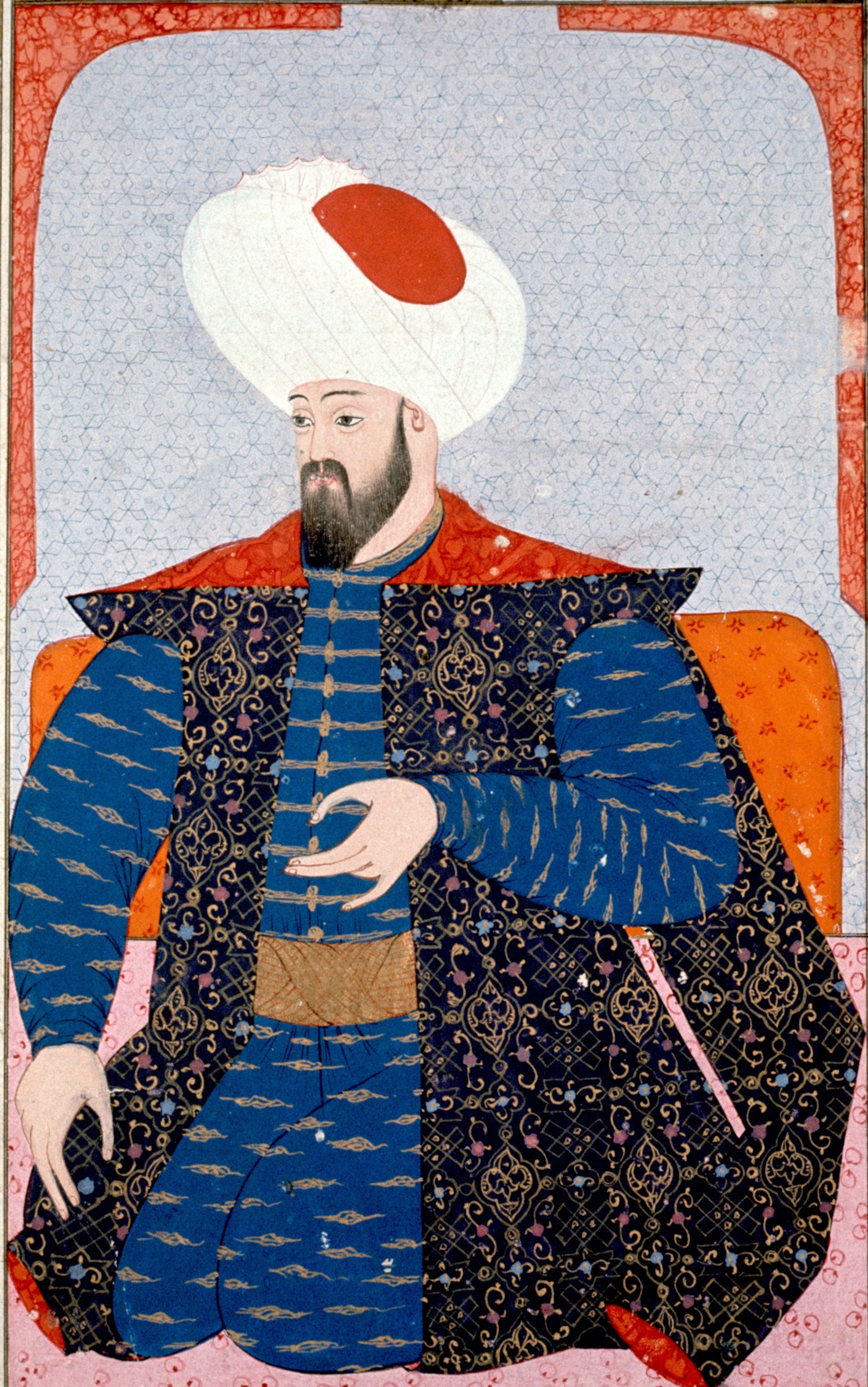 a man in a blue gown with a puffy white headdress
