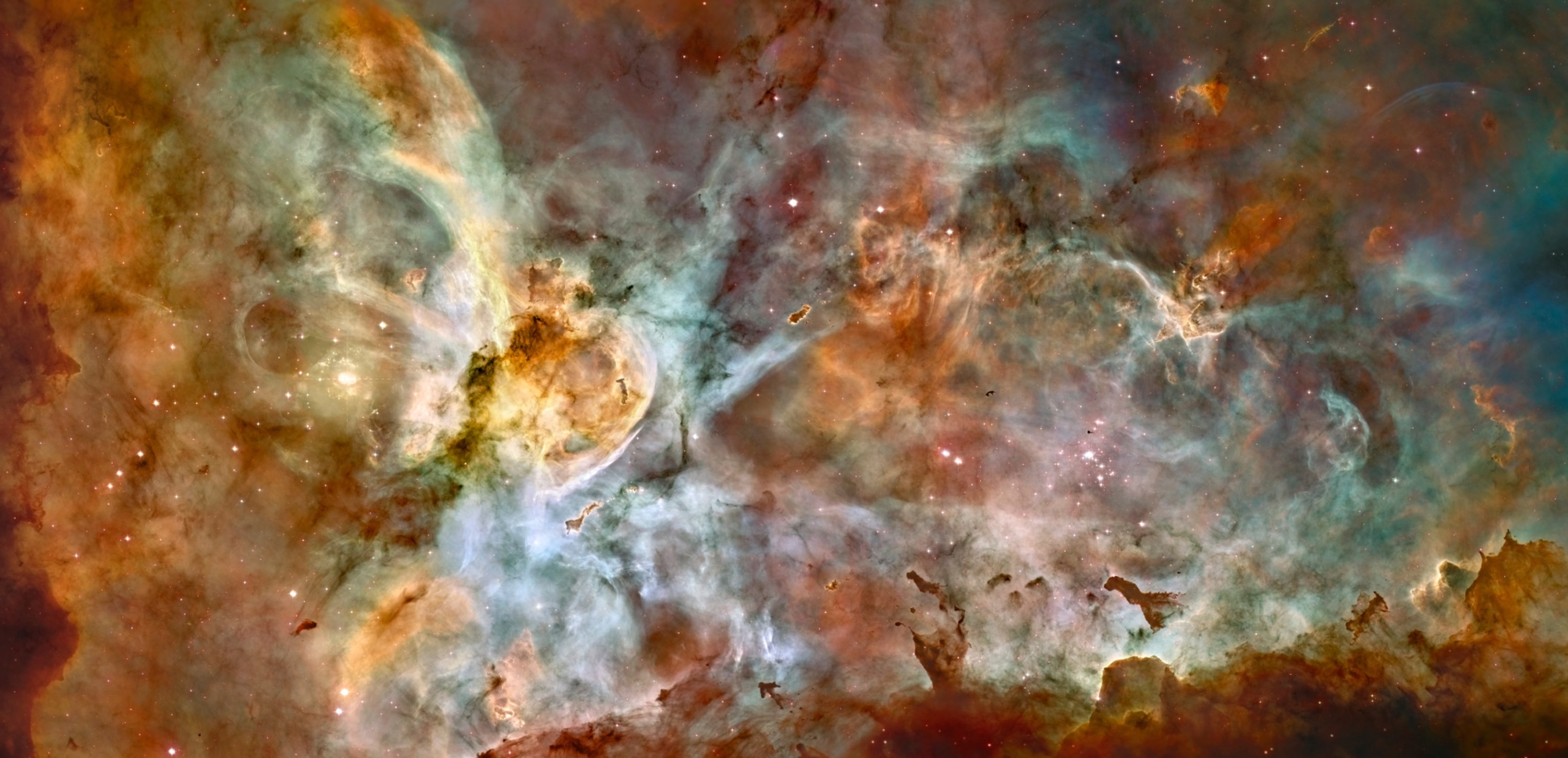 star birth and star death create cosmic havoc in a panorama of the Carina Nebula