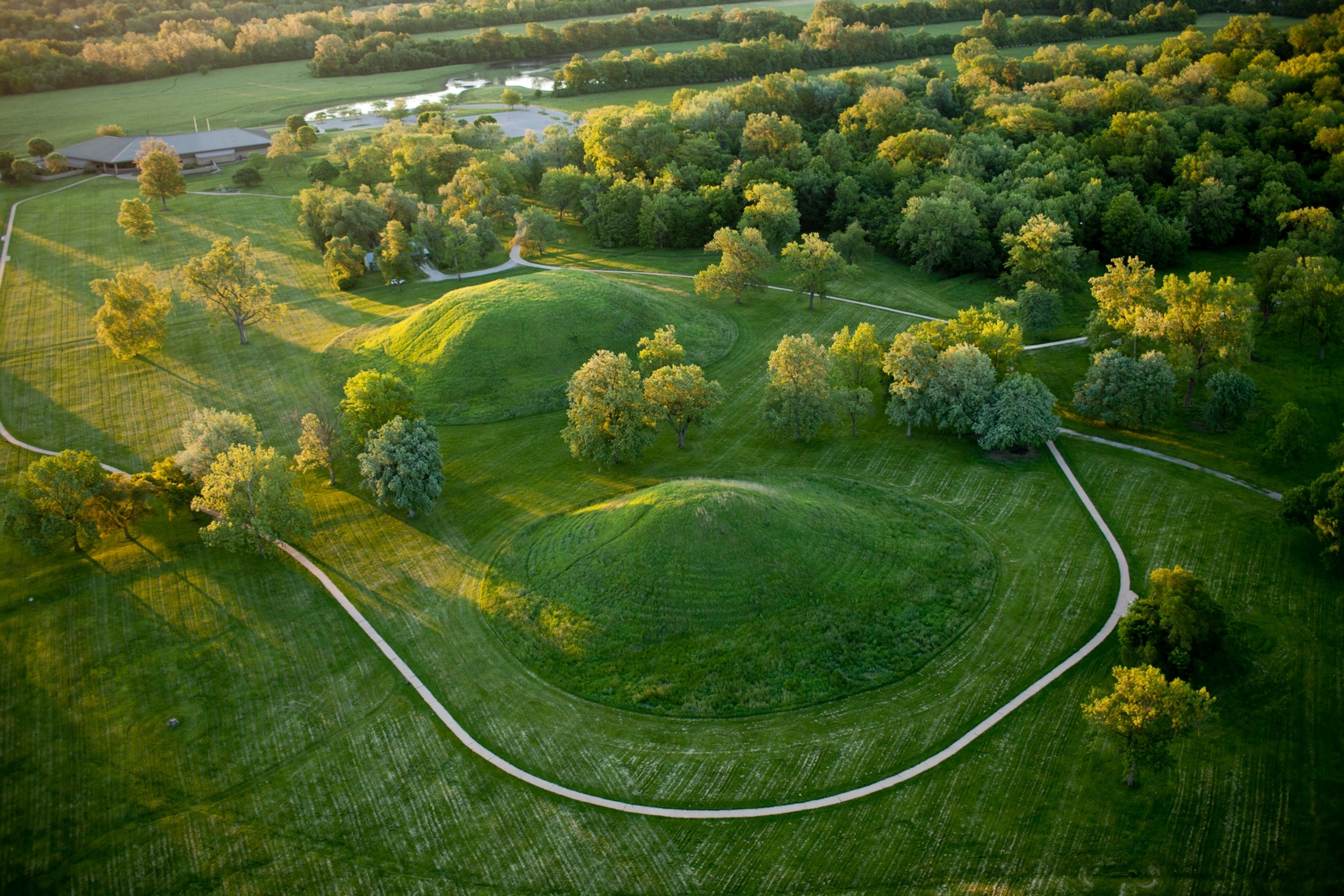 a couple of mounds of green grass growing over what used to be Cahokia's central plaza