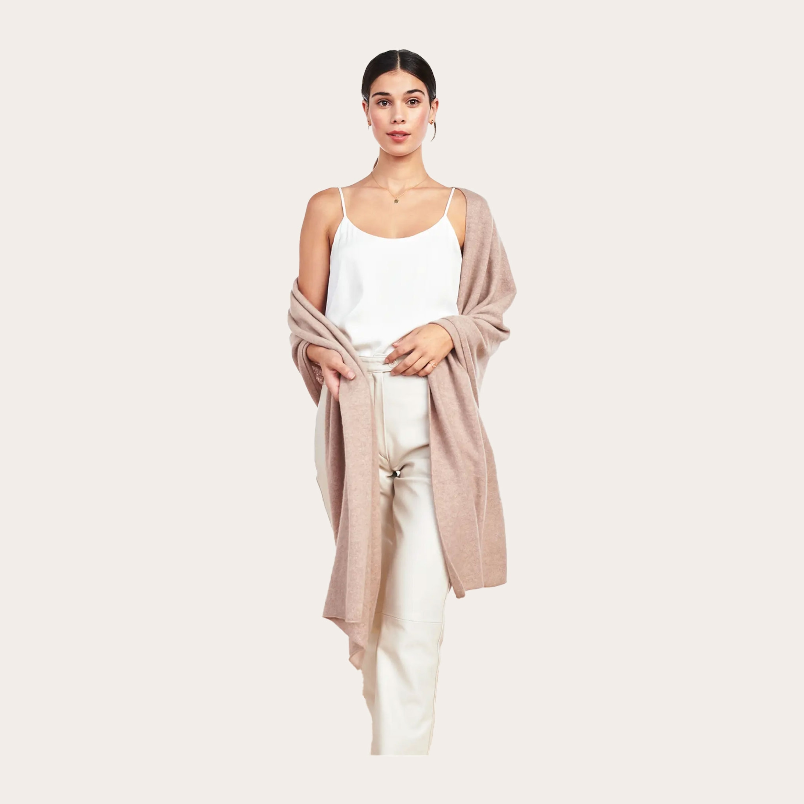 Woman wearing a tan colored sweater.