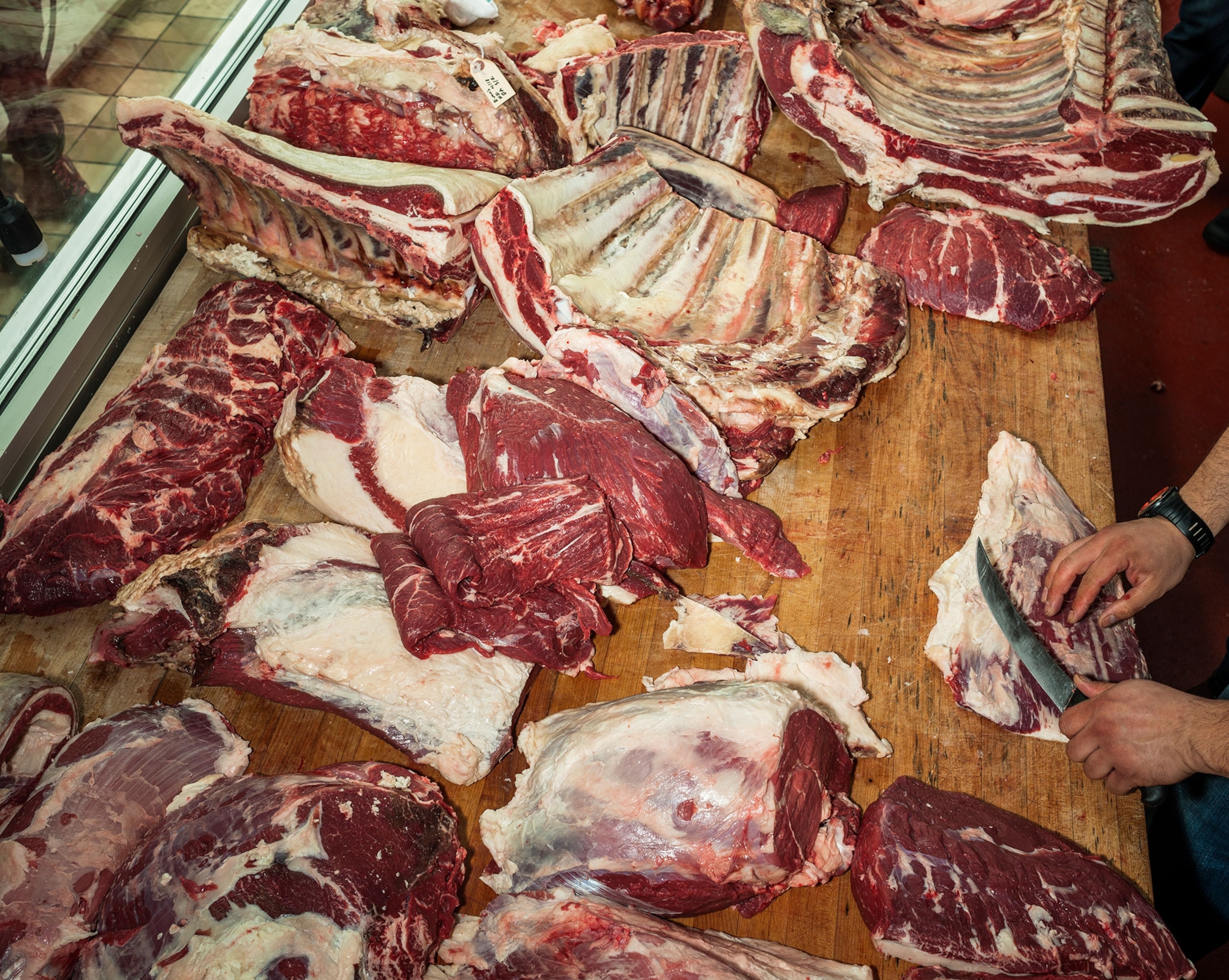 a butcher cutting meat