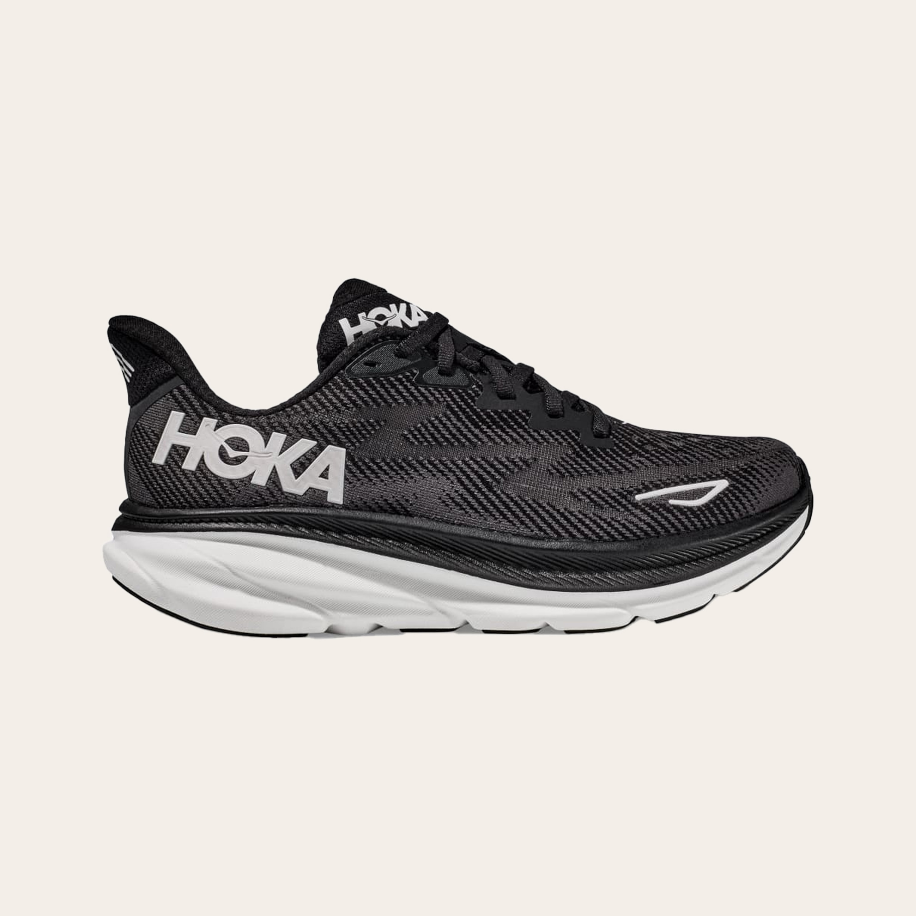 A black and white pair of Hoka Clifton 9 shoes