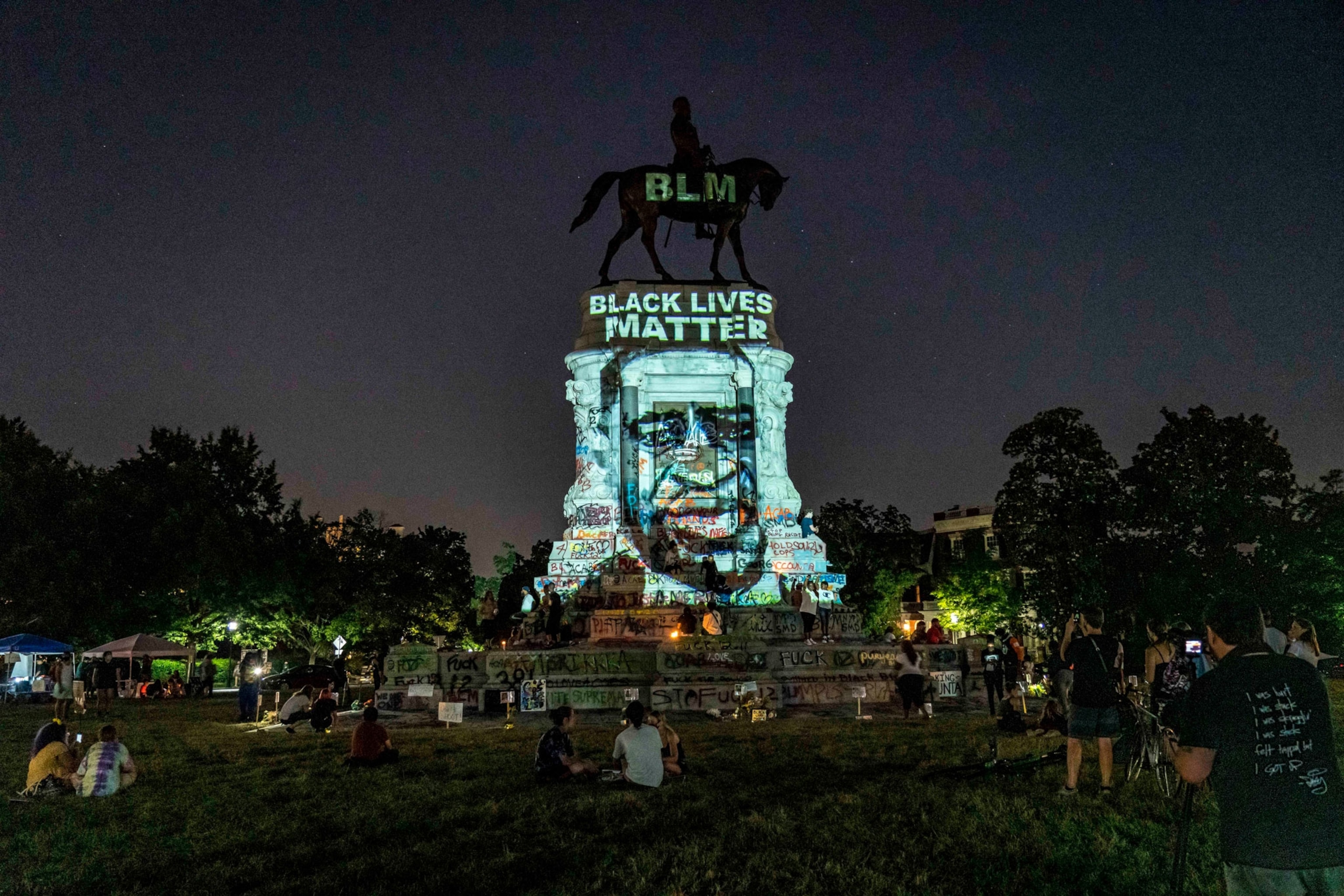 an image of George Floyd projected on the statue of Robert E. Lee in Richmond, Virginia