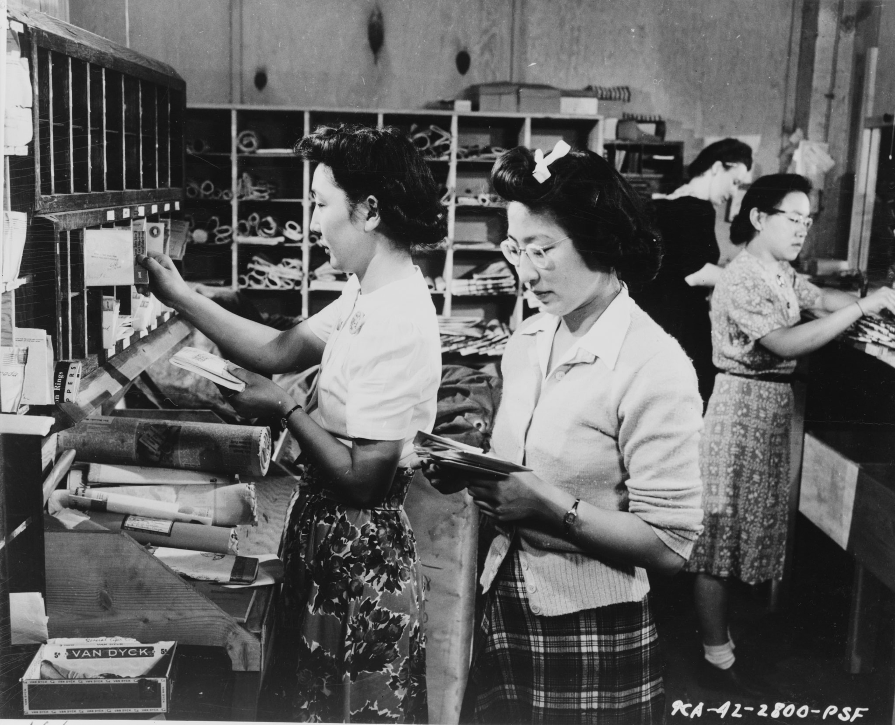 women sorting mail
