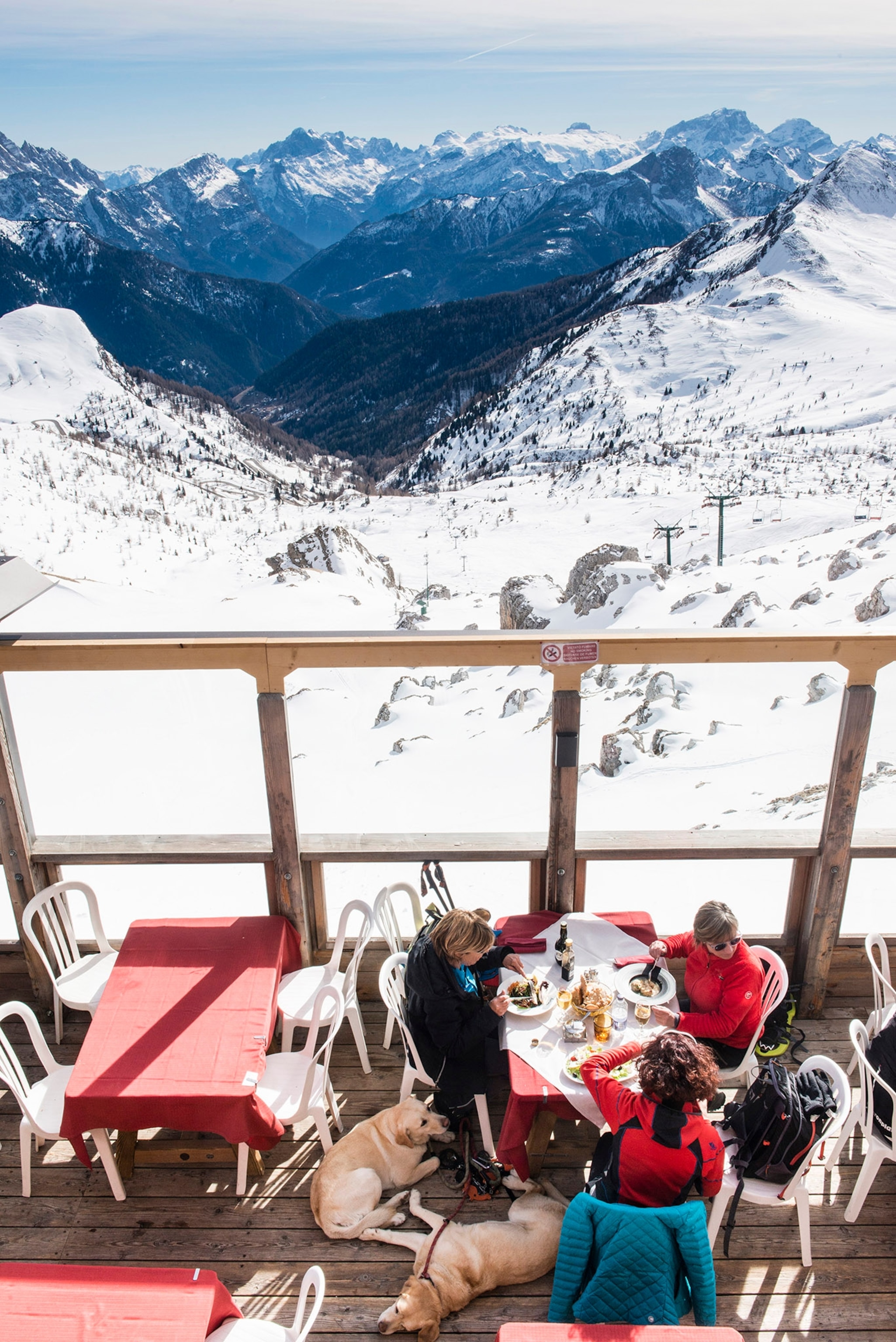 Diners at Rifugio Averau, an alpine inn in the Dolomite Range of northeastern Italy, in March 2019. Ski safaris, which let travelers crisscross the scenic towns and valleys of places like Cortina, Civetta, Val Gardena and Arabba, sleeping at different alpine inns each night, have become increasingly popular here and elsewhere.