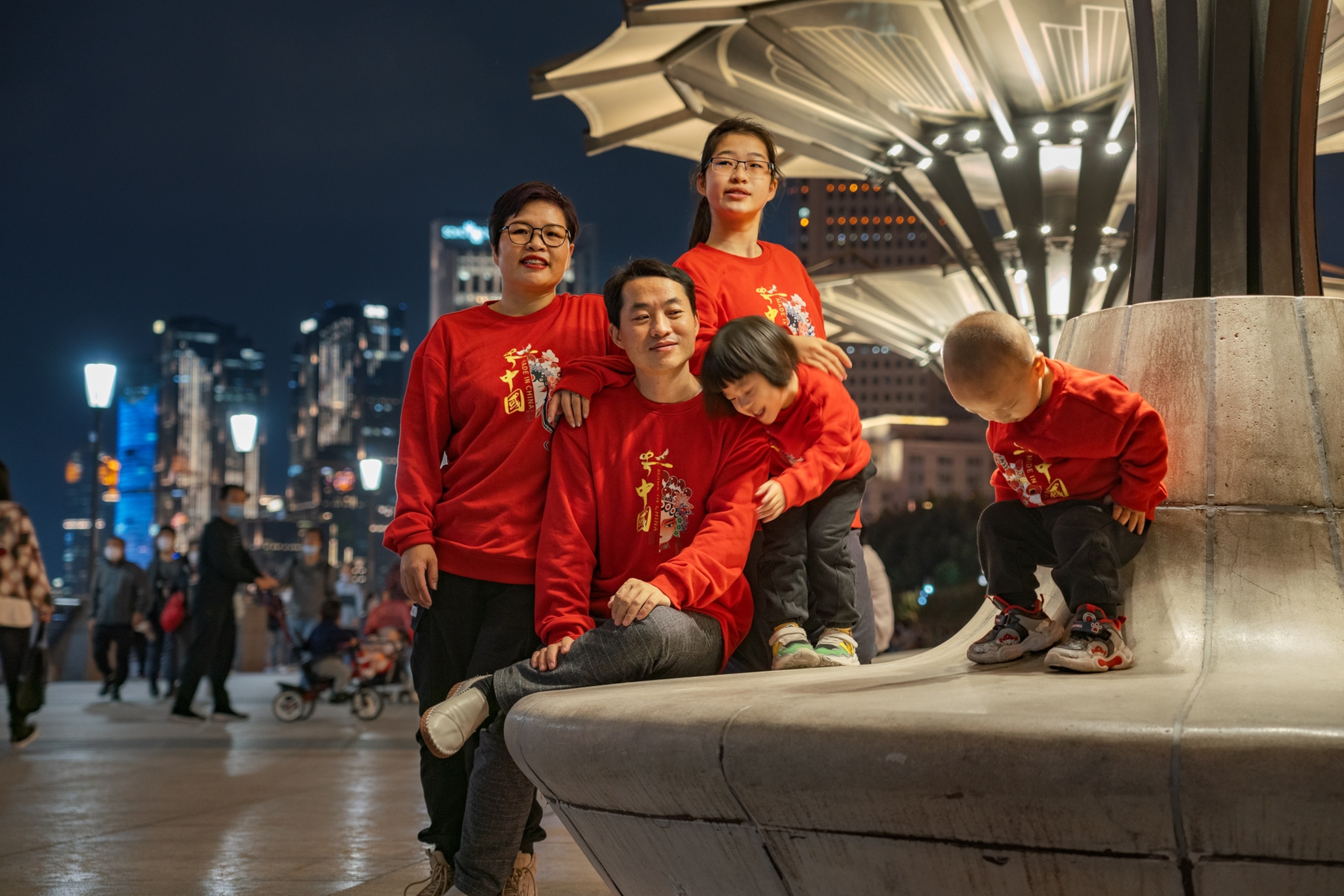 Picture of parents with children all dressed in red.