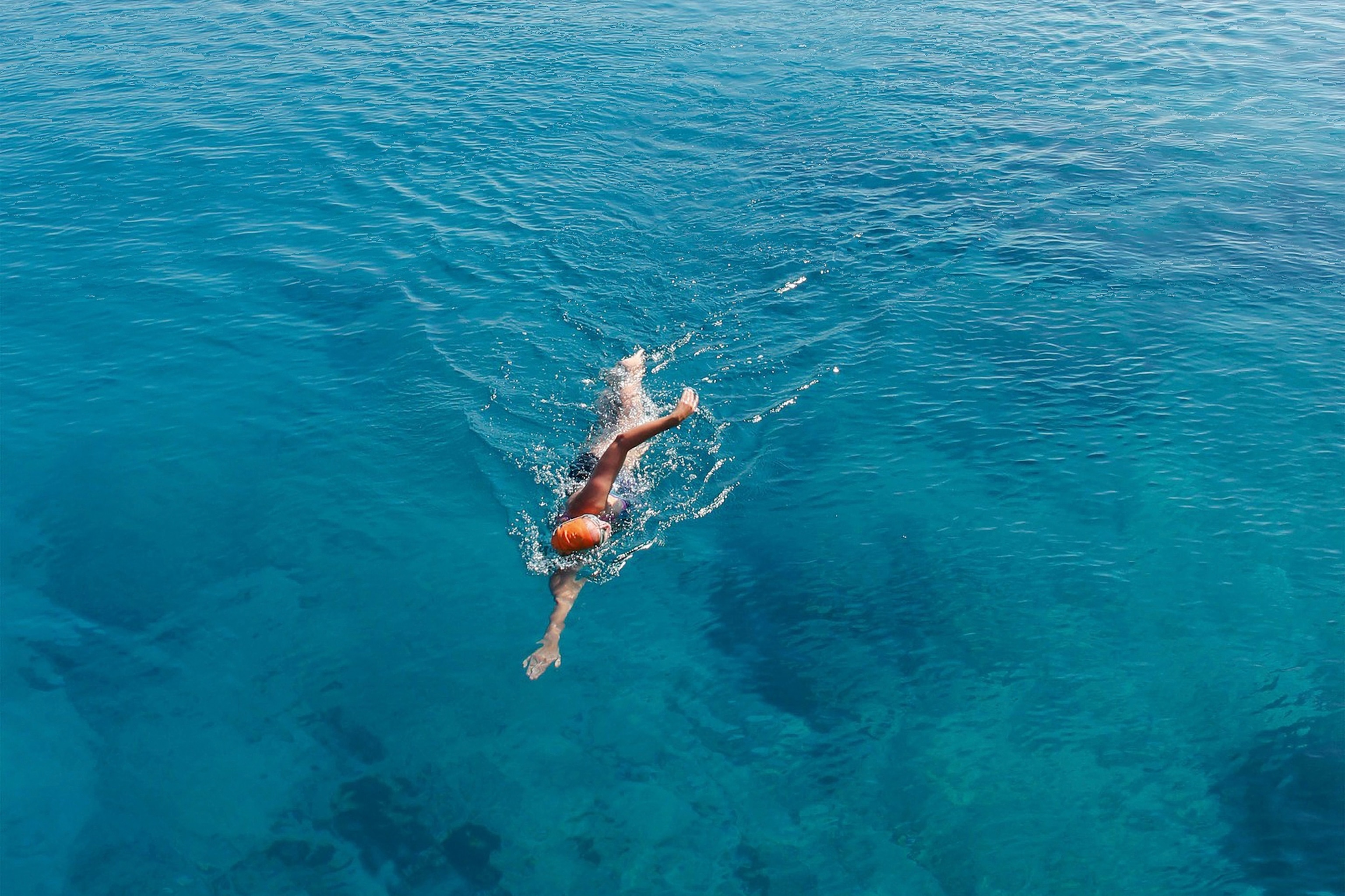 Person open water swimming near the Lycian Way, Turkey.