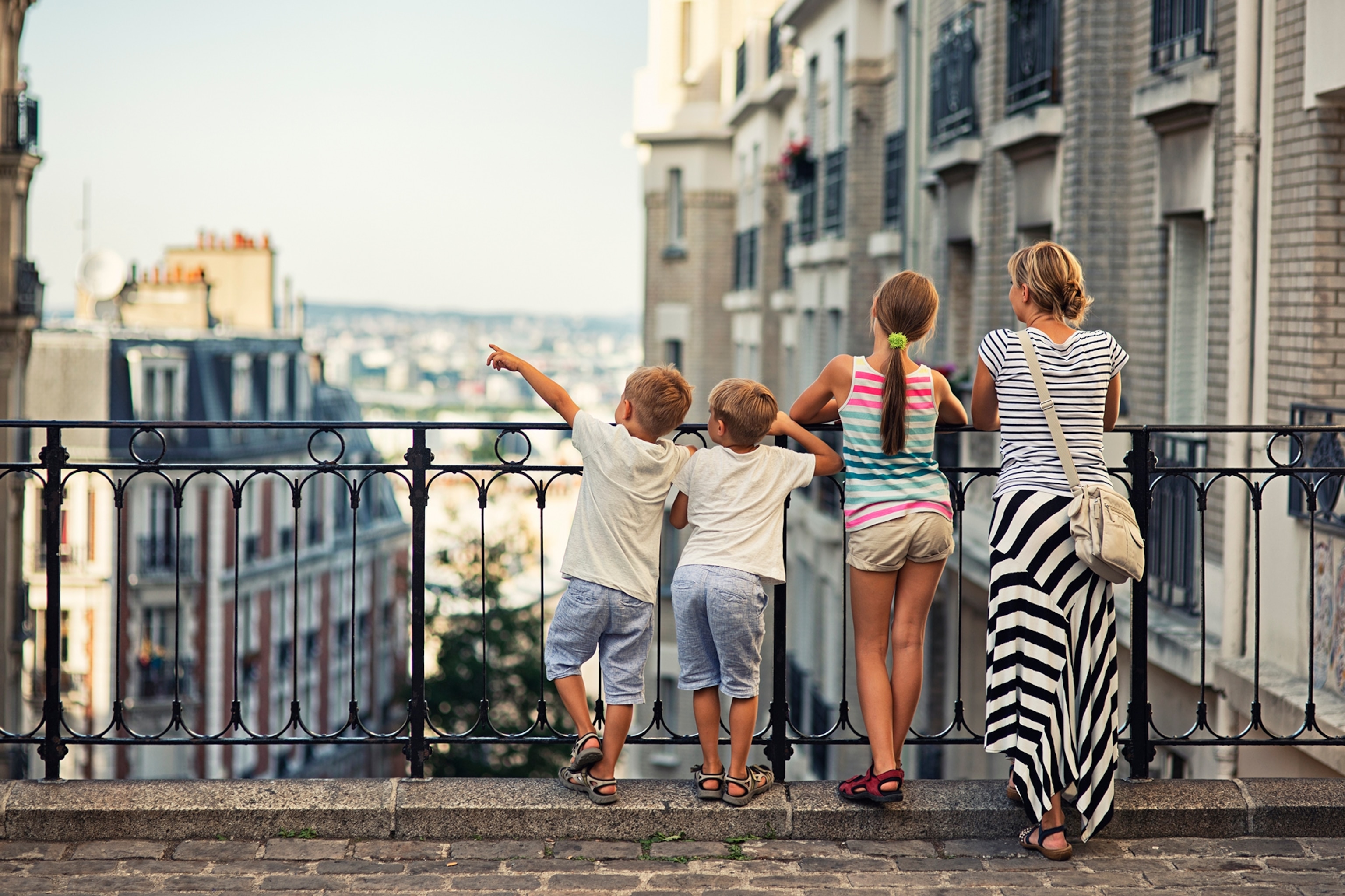 A family looking out to Paris's skyline
