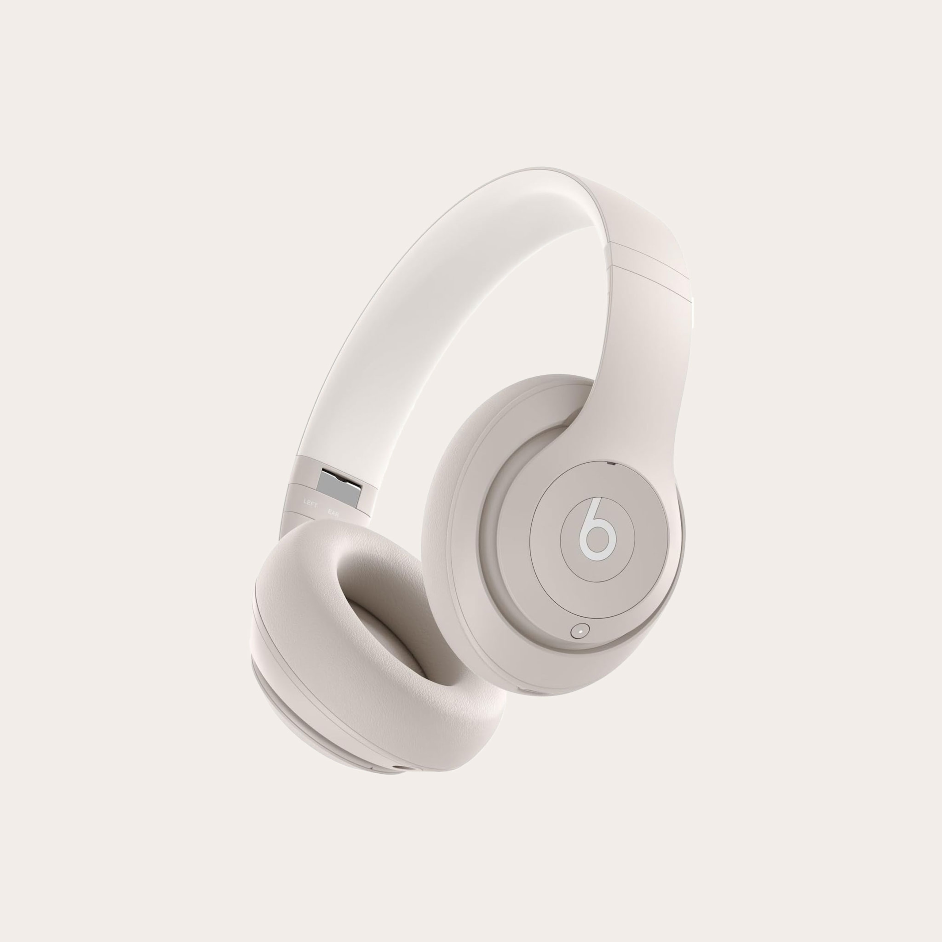 Cream colored over the ear headphones