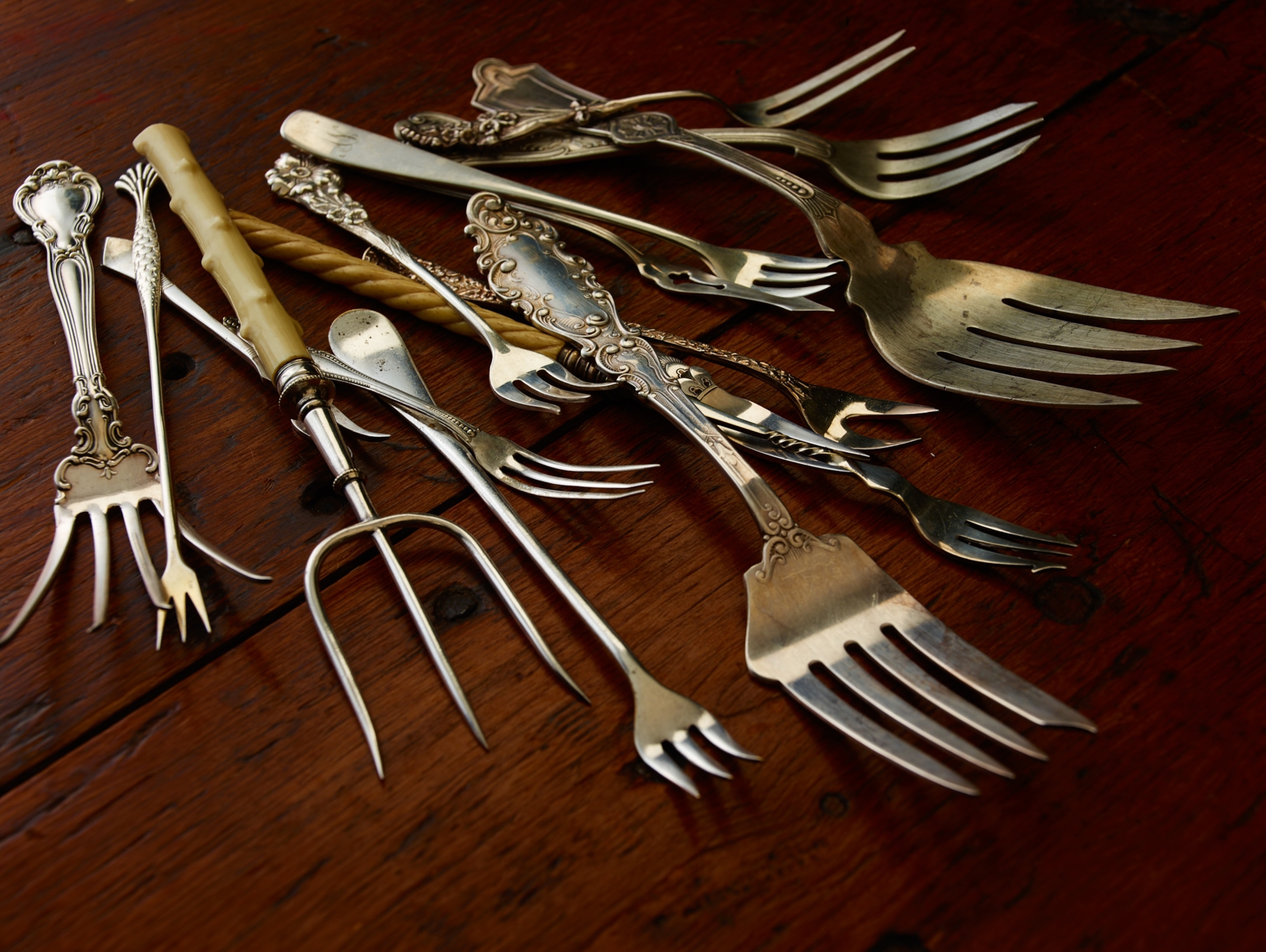 A table with a variety of forks.