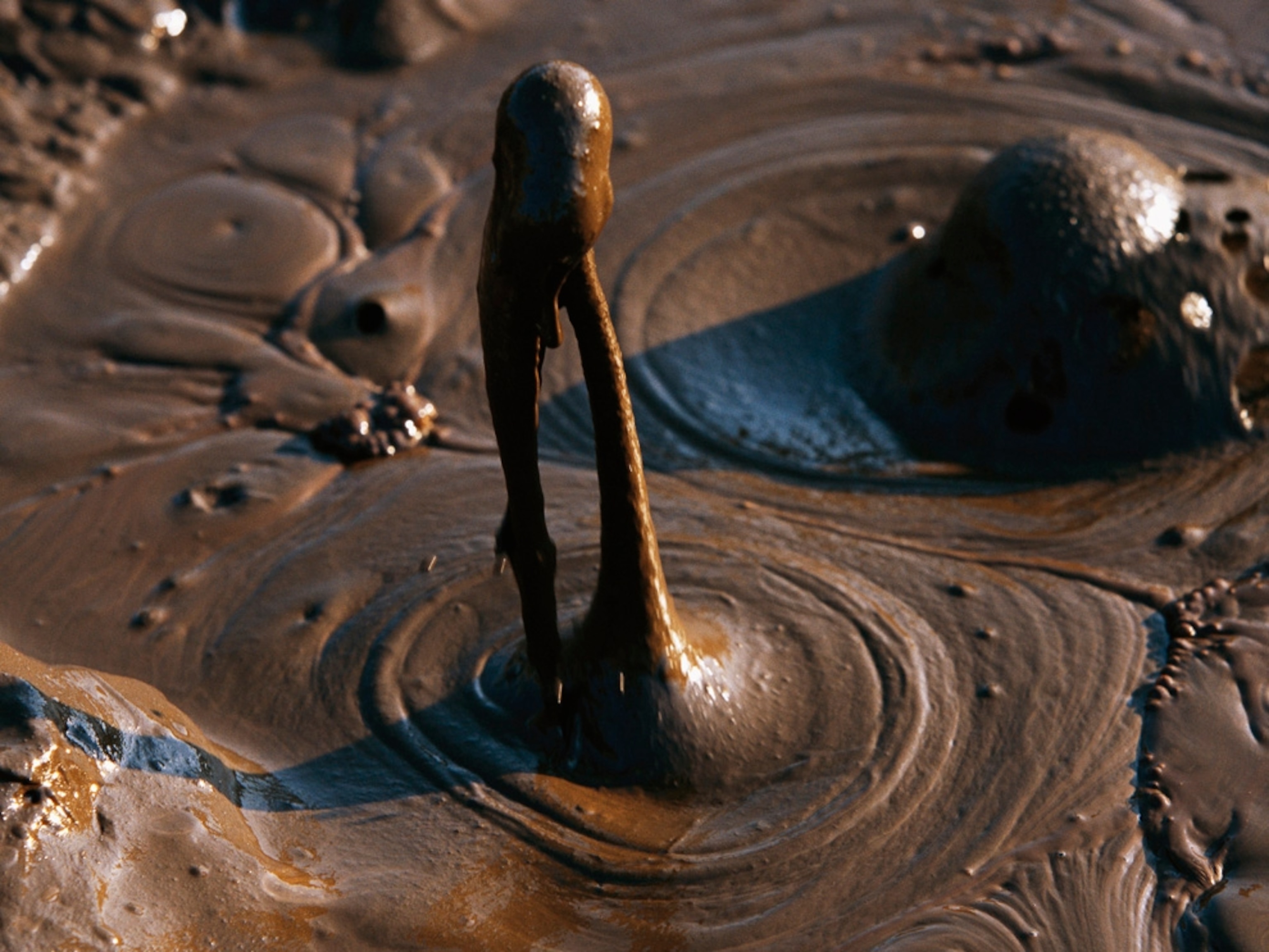 Boiling brown mud