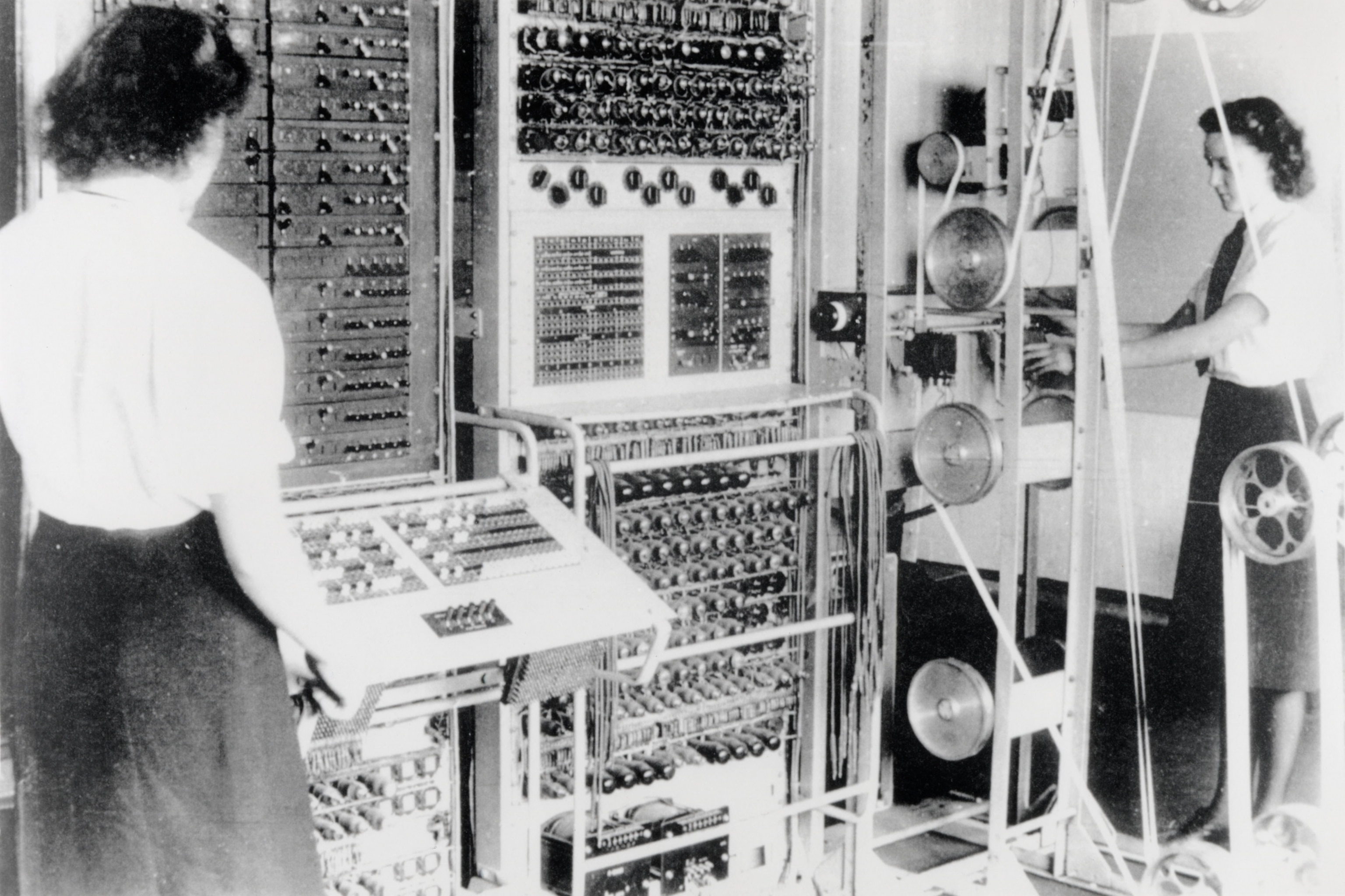 Women's Royal Naval Service members operate the enormous Colossus computer.