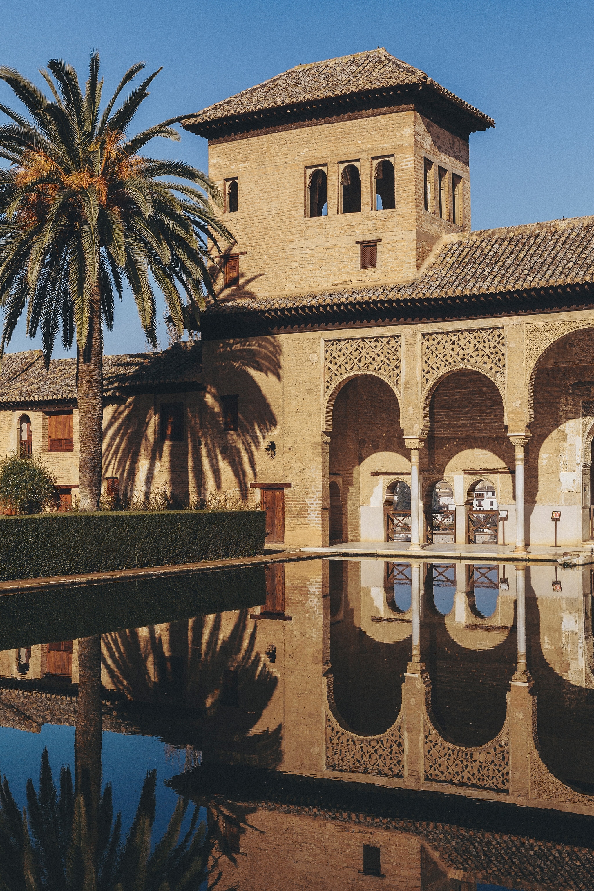 The exterior of the Alhambra Palace and the reflecting pool