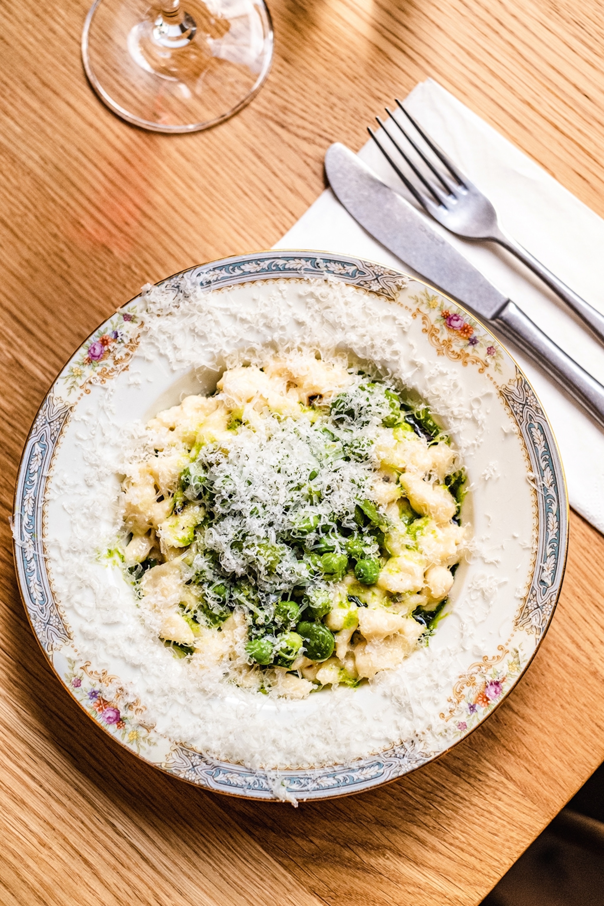 Spaetzle — German egg noodle pasta with a chewy dumpling-like texture, with greens and cheese.