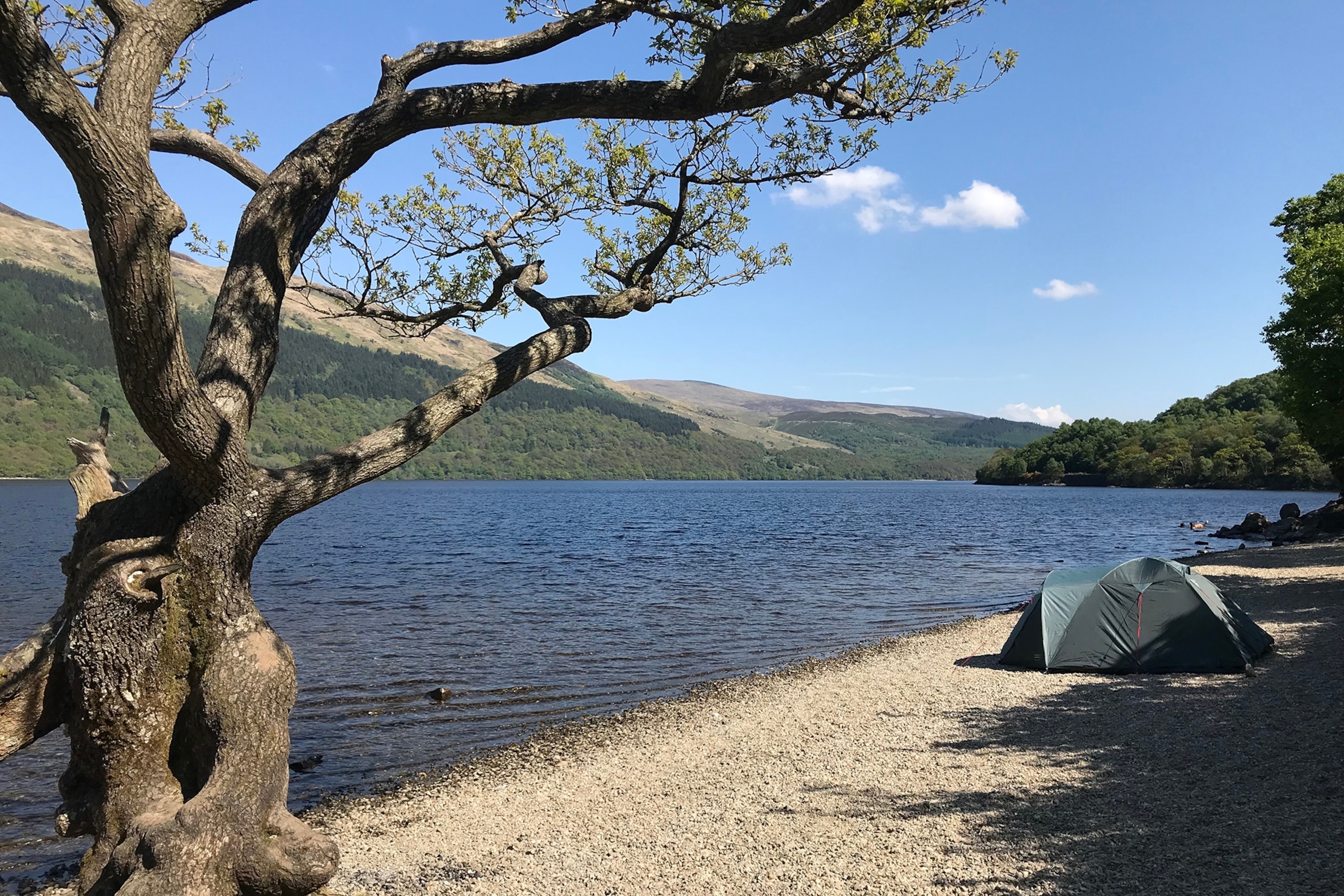 a tent next to a lake