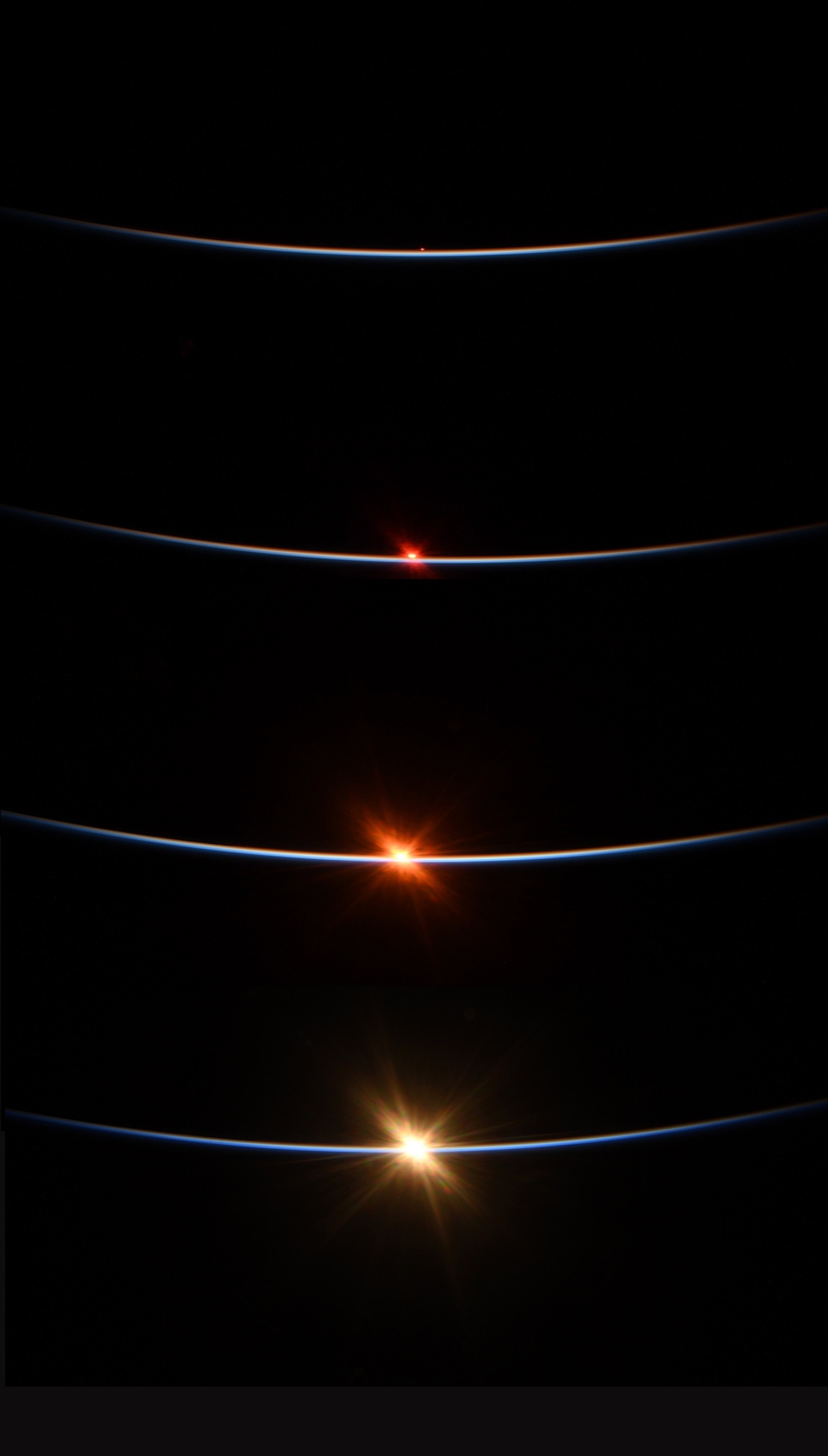 four orbits with bright dots on three of them.