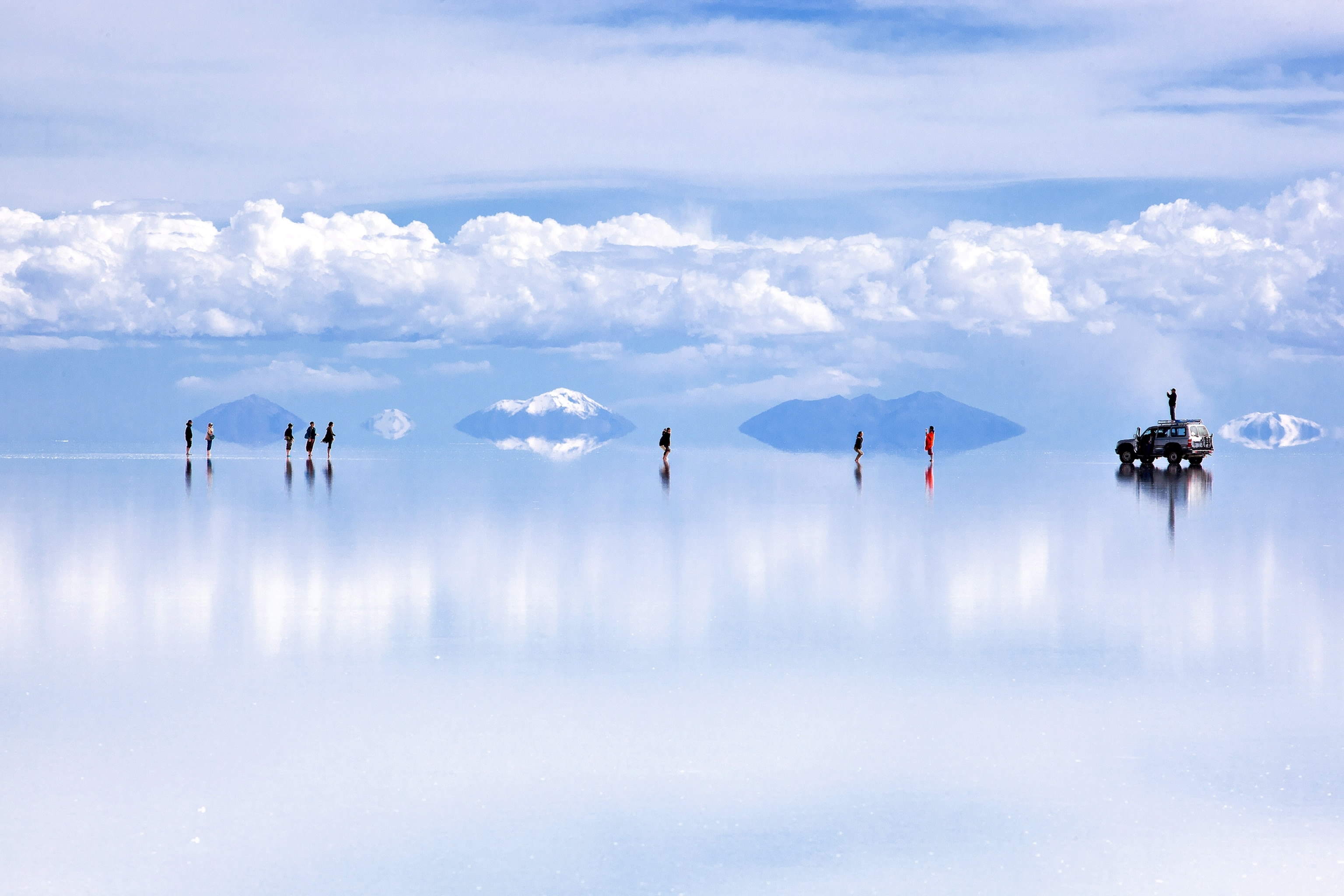 tourists on the salt flats of Salar de Uyuni, Bolivia