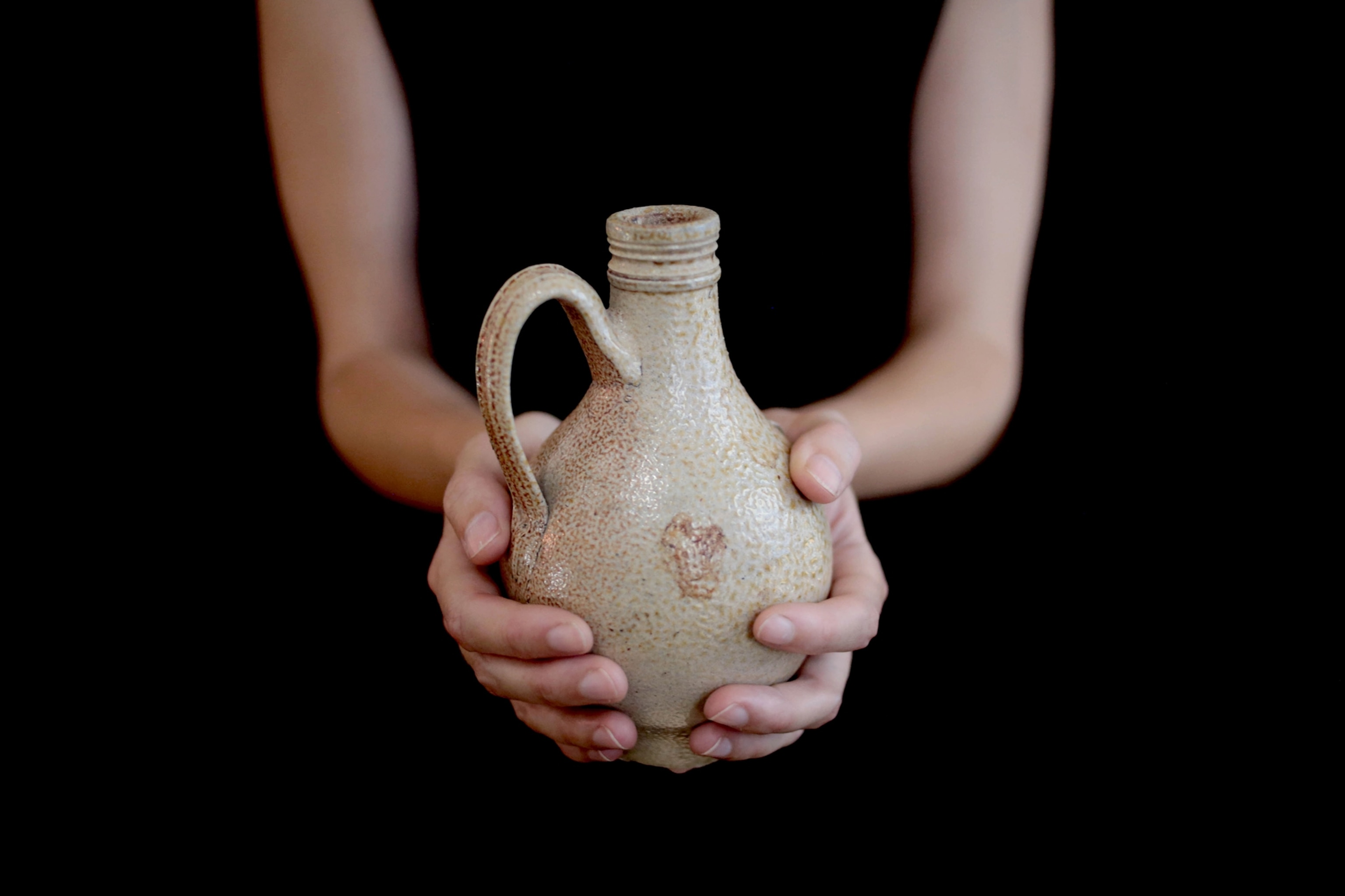 Woman holding witch bottle
