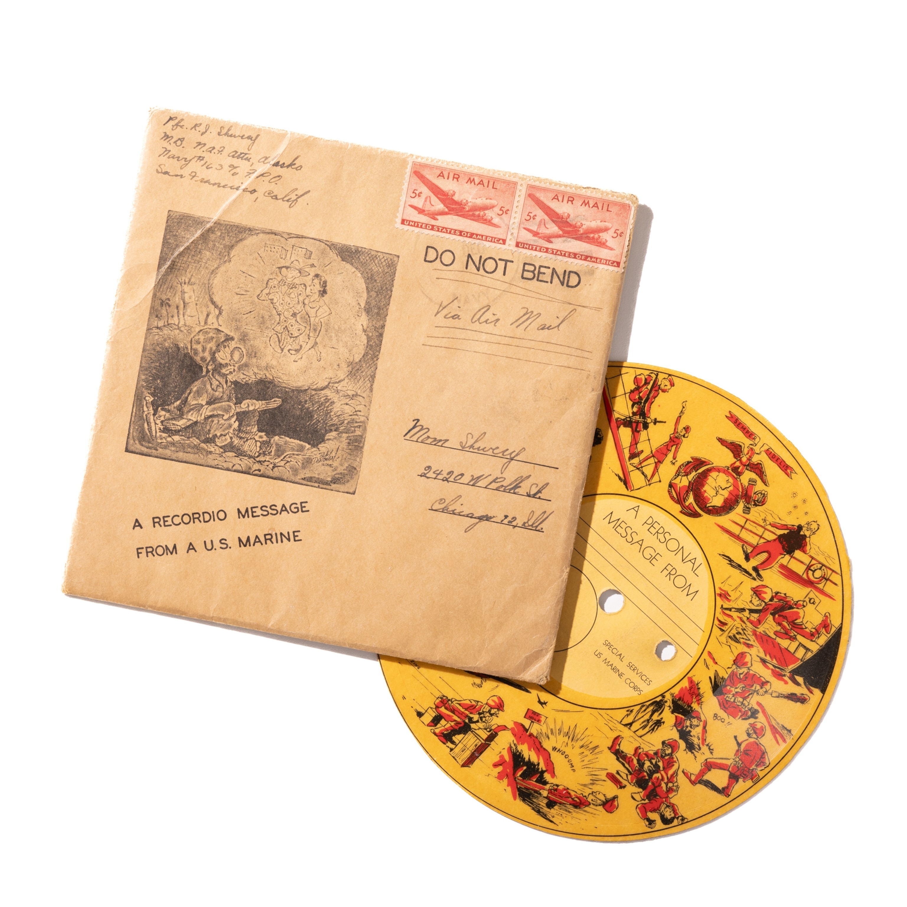 Photo of small colorful record and square envelope used to send it