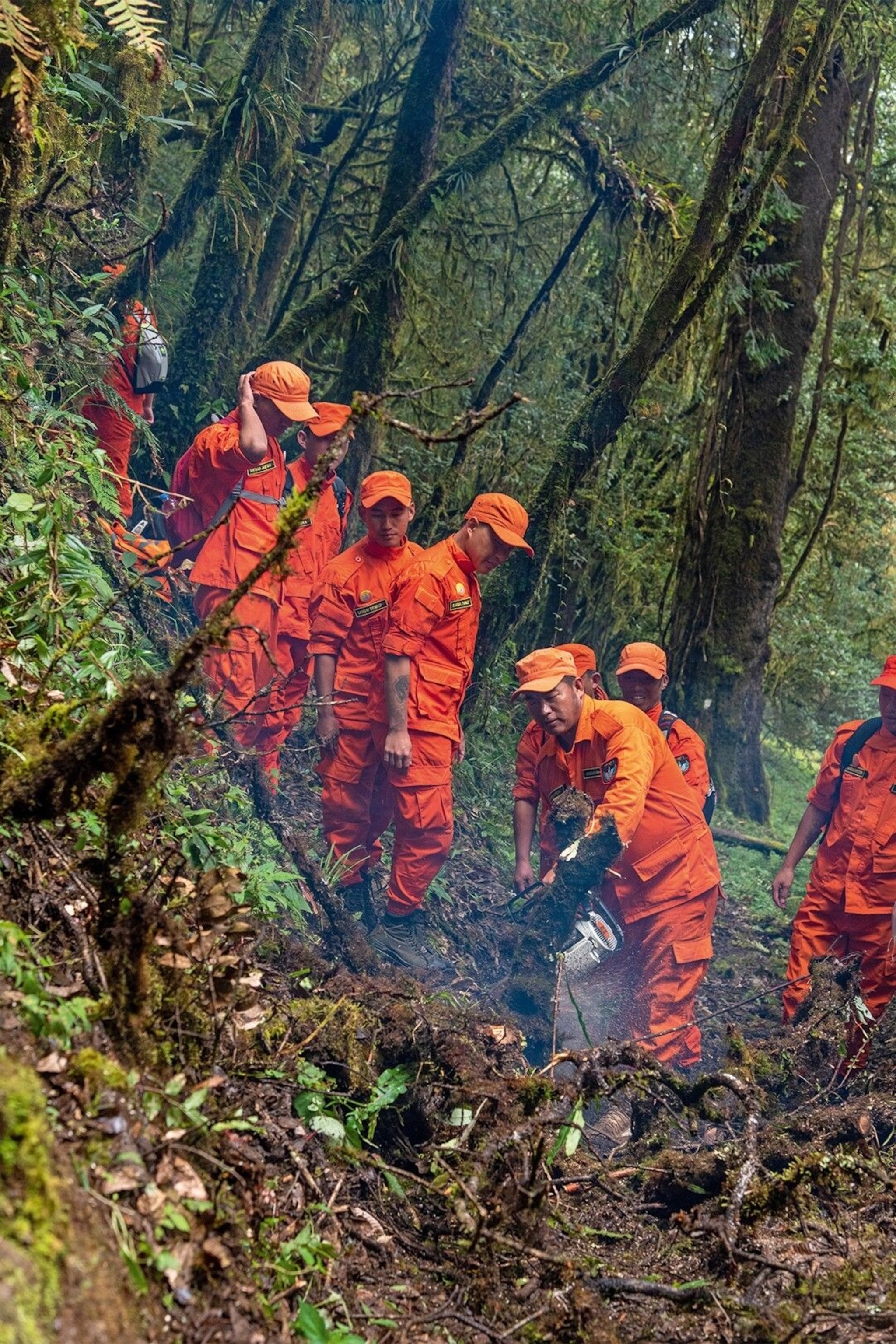 Volunteers from the DeSuung project help to maintain the Trans-Bhutan Trail.
