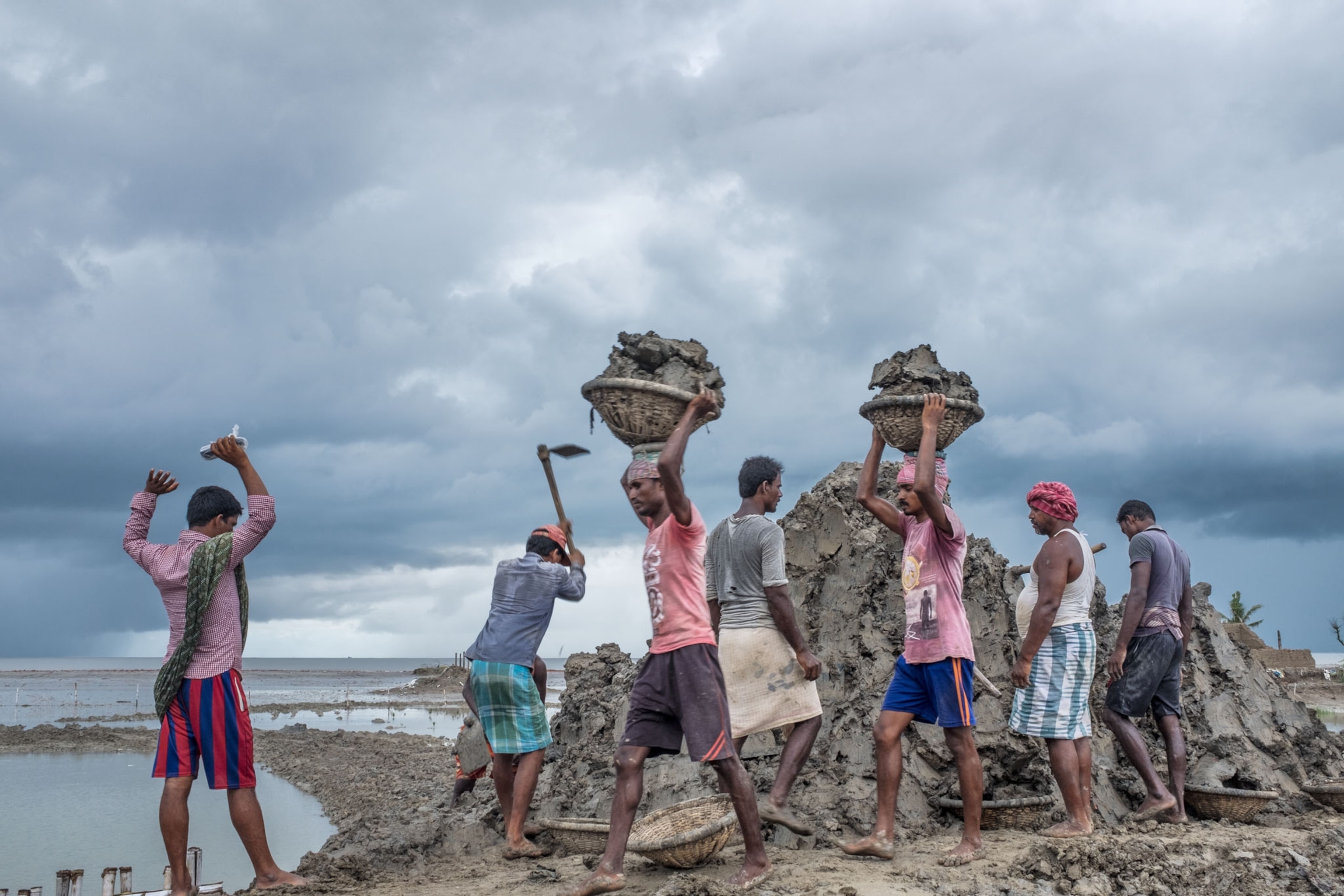 people working on the shore