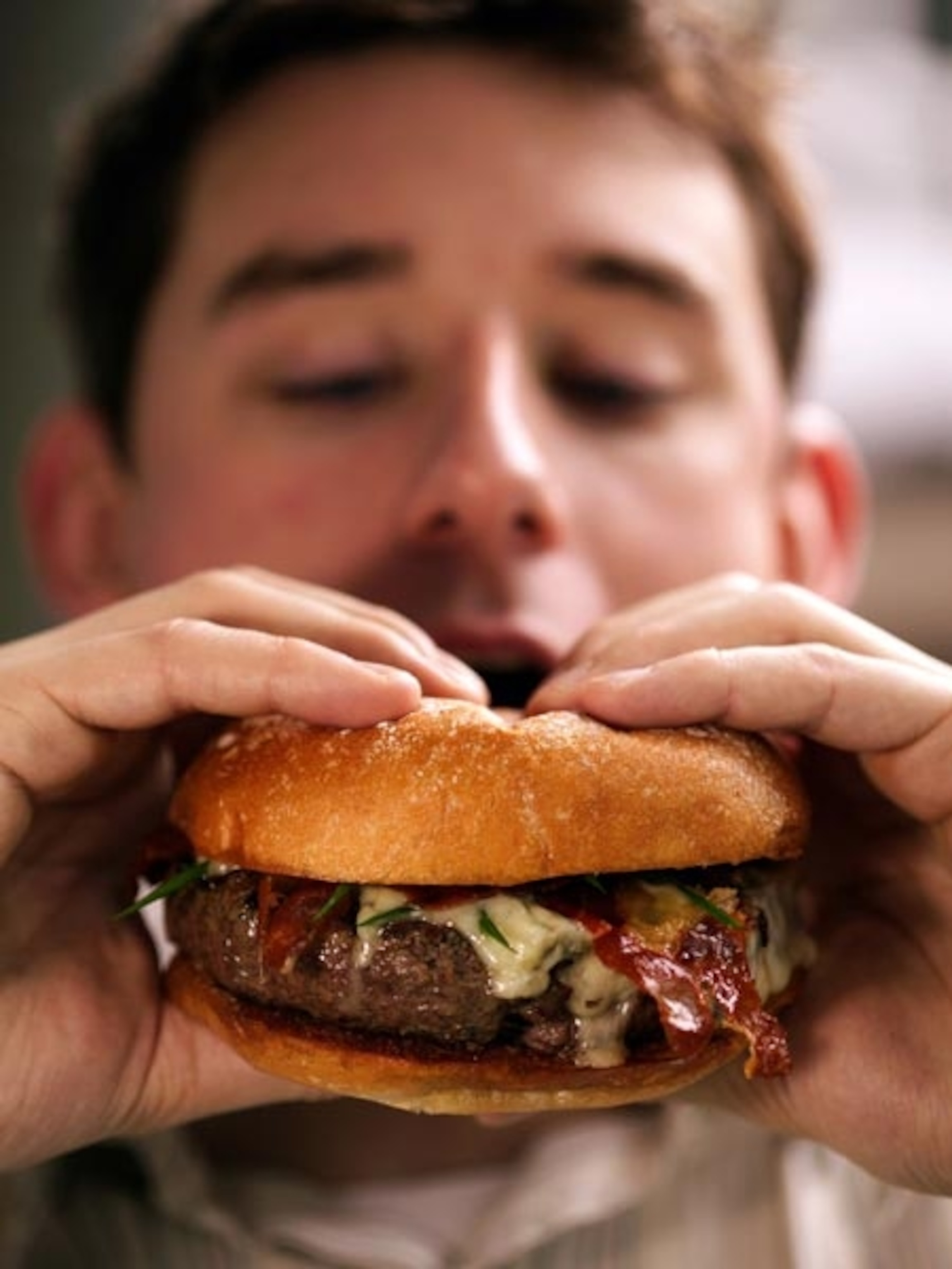 Man eating burger