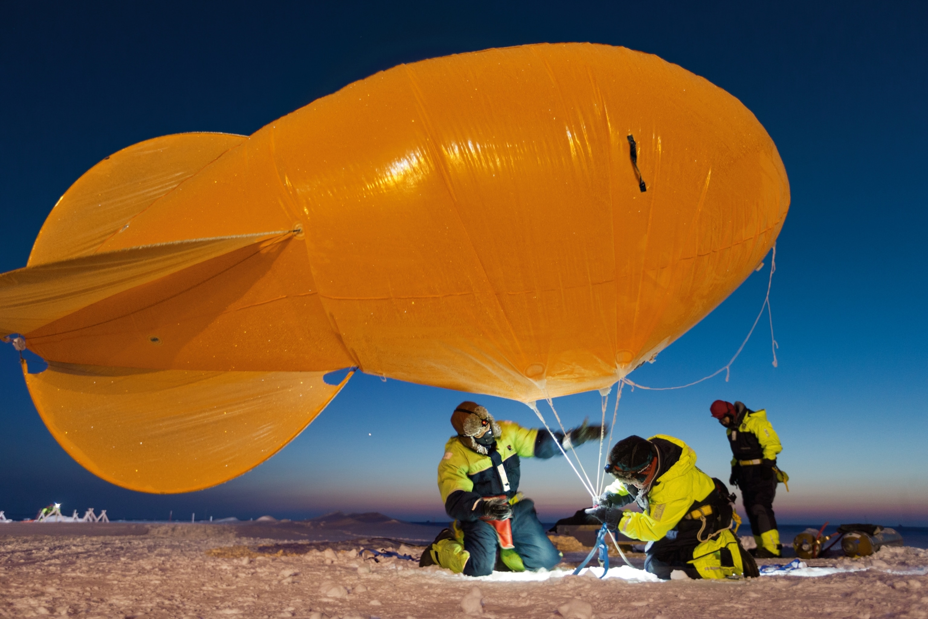 Scientists launching a balloon for atmospheric research