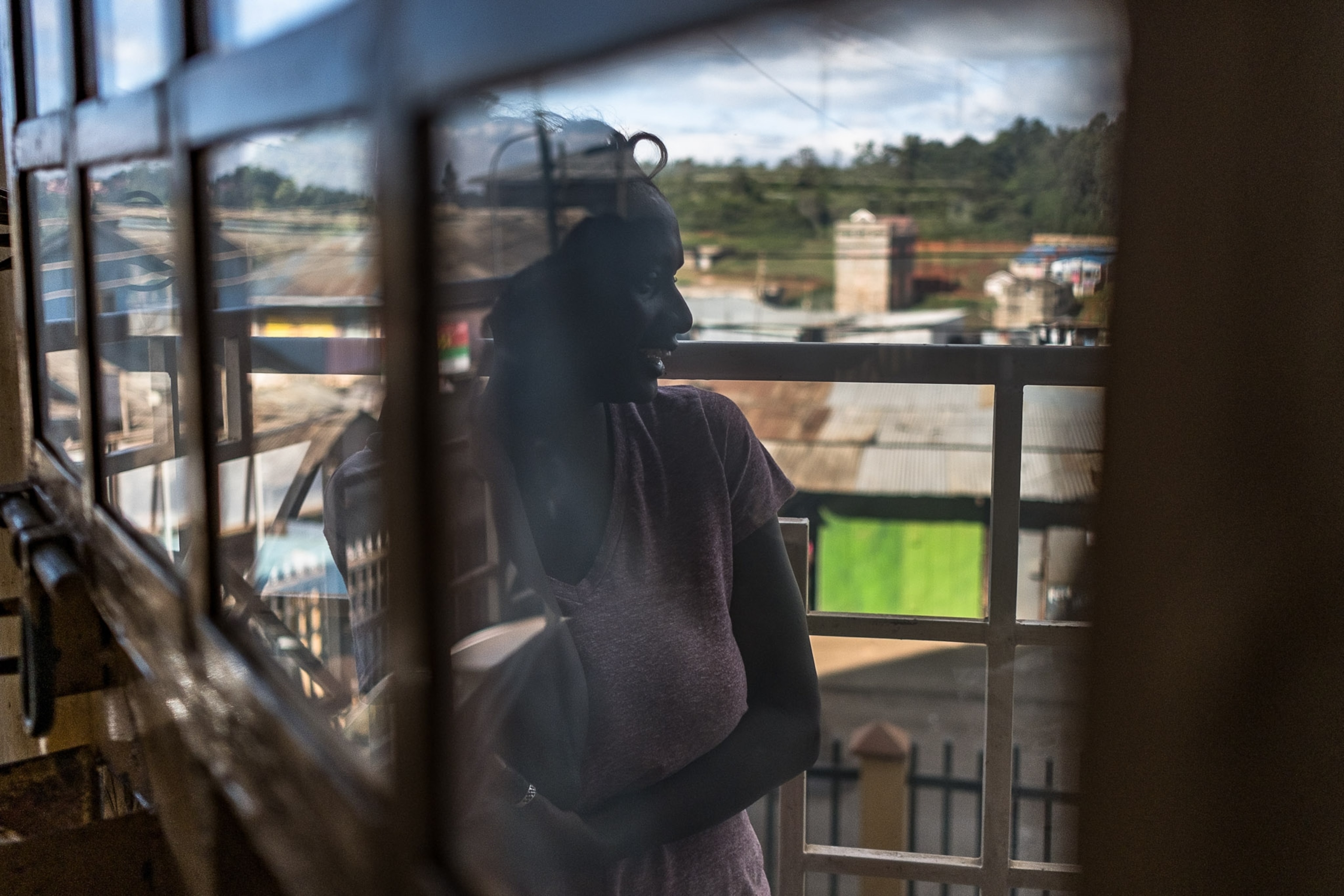 a reflection of a woman in a window